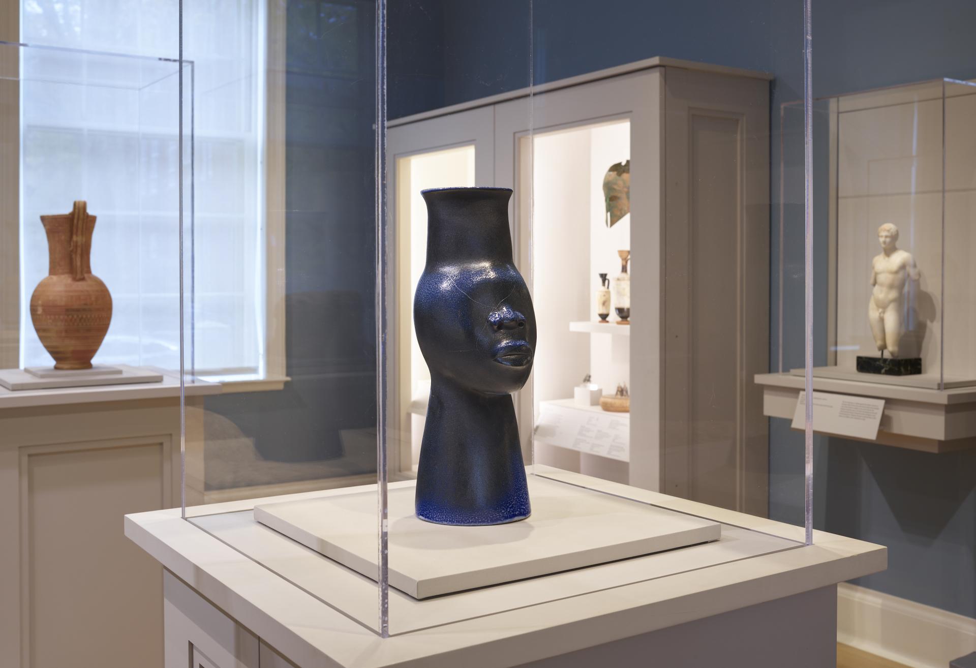 Installation shot of Simone Leigh "108 (Face Jug Series)" sculpture on view in the Greek and Roman gallery