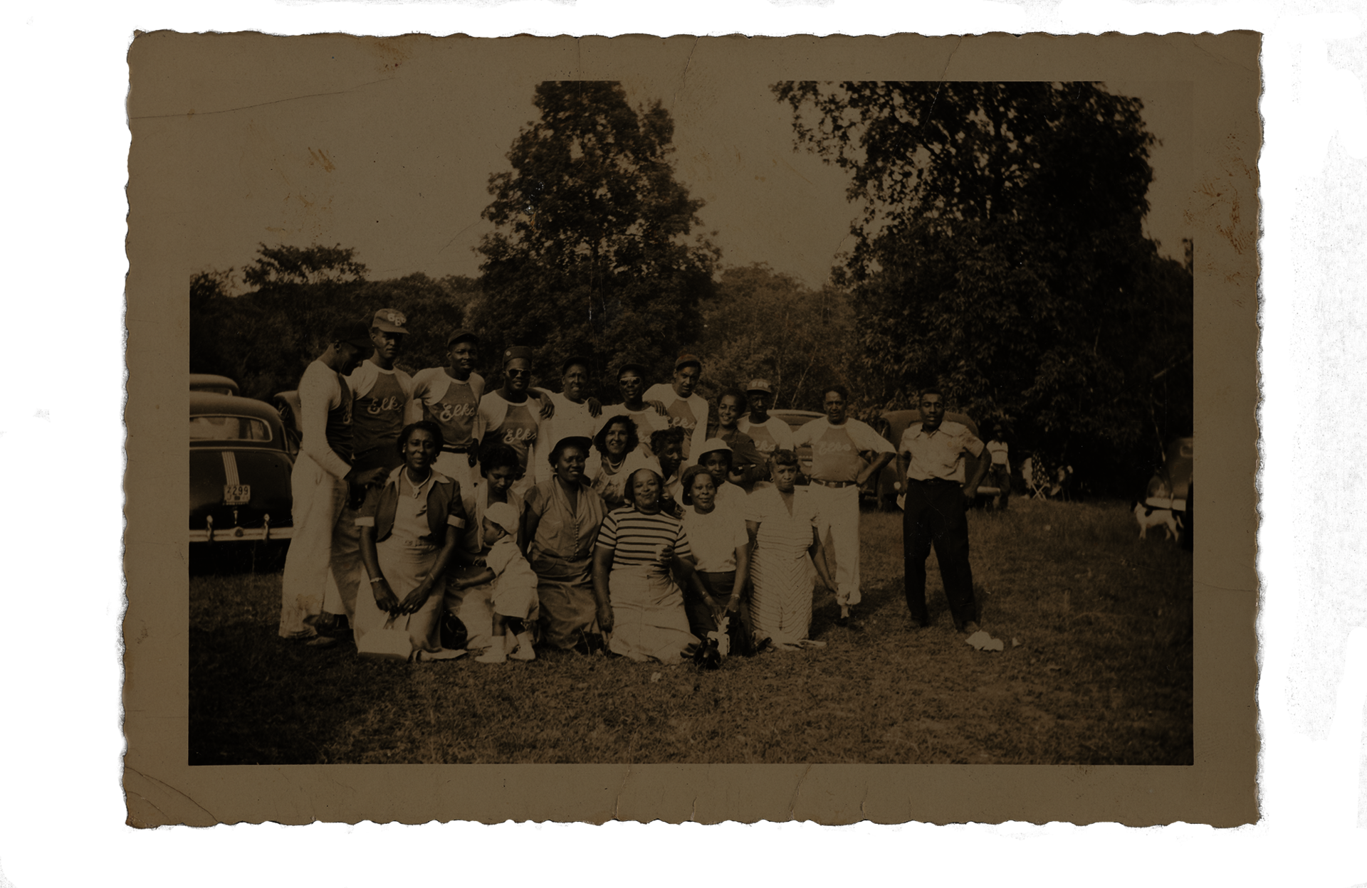 sepia tinted group photo of baseball players and friends