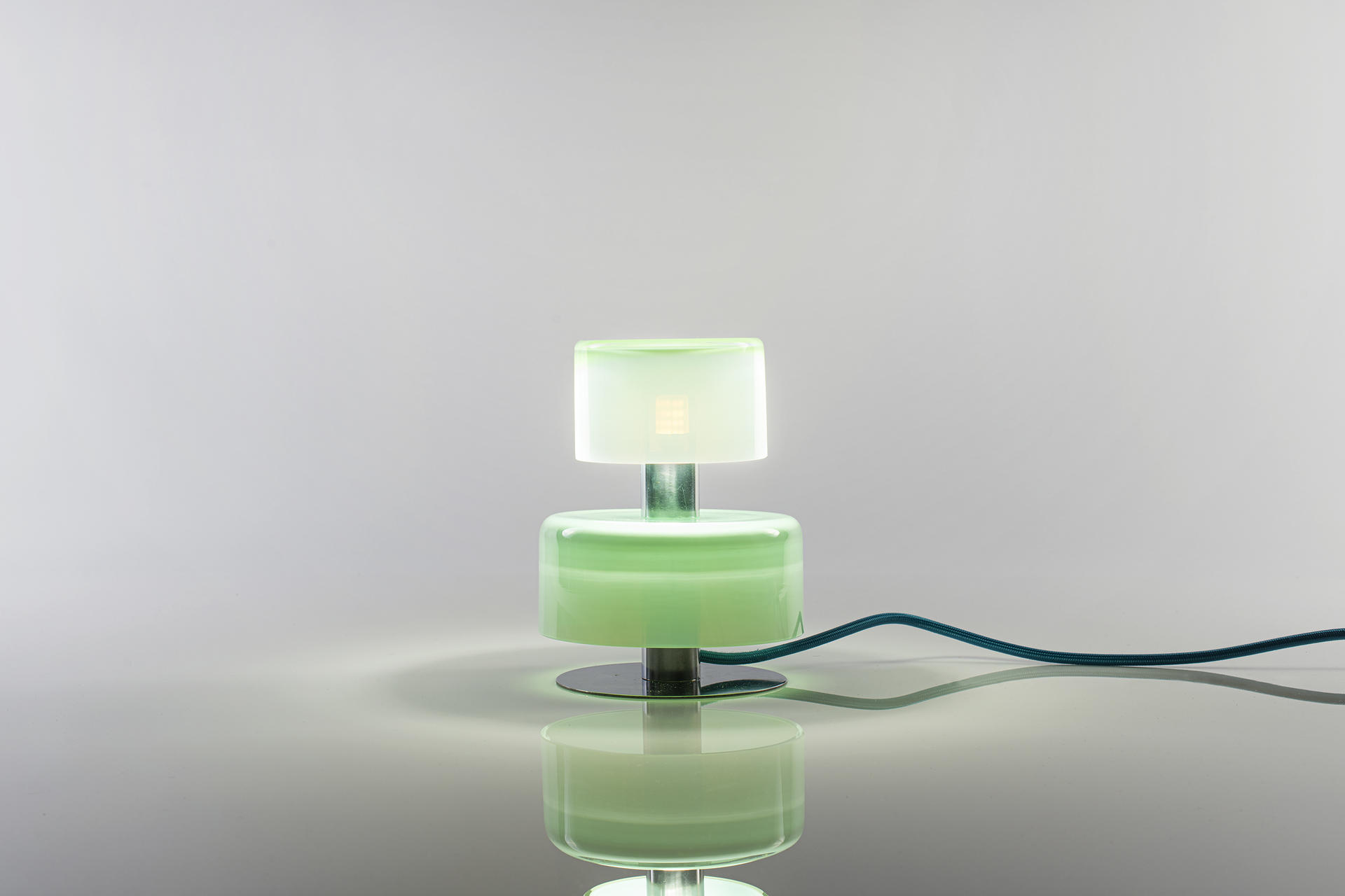 A night lamp with three part of hand-made blown forms. It is a stackable modular system  