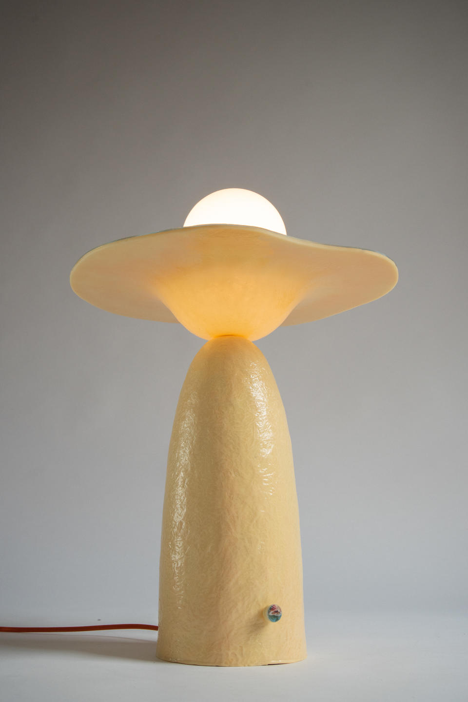 Detail image of the glowing underside of horizon lamp.