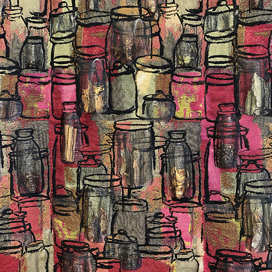 Colorful woven textile with a hand-drawn jar motif