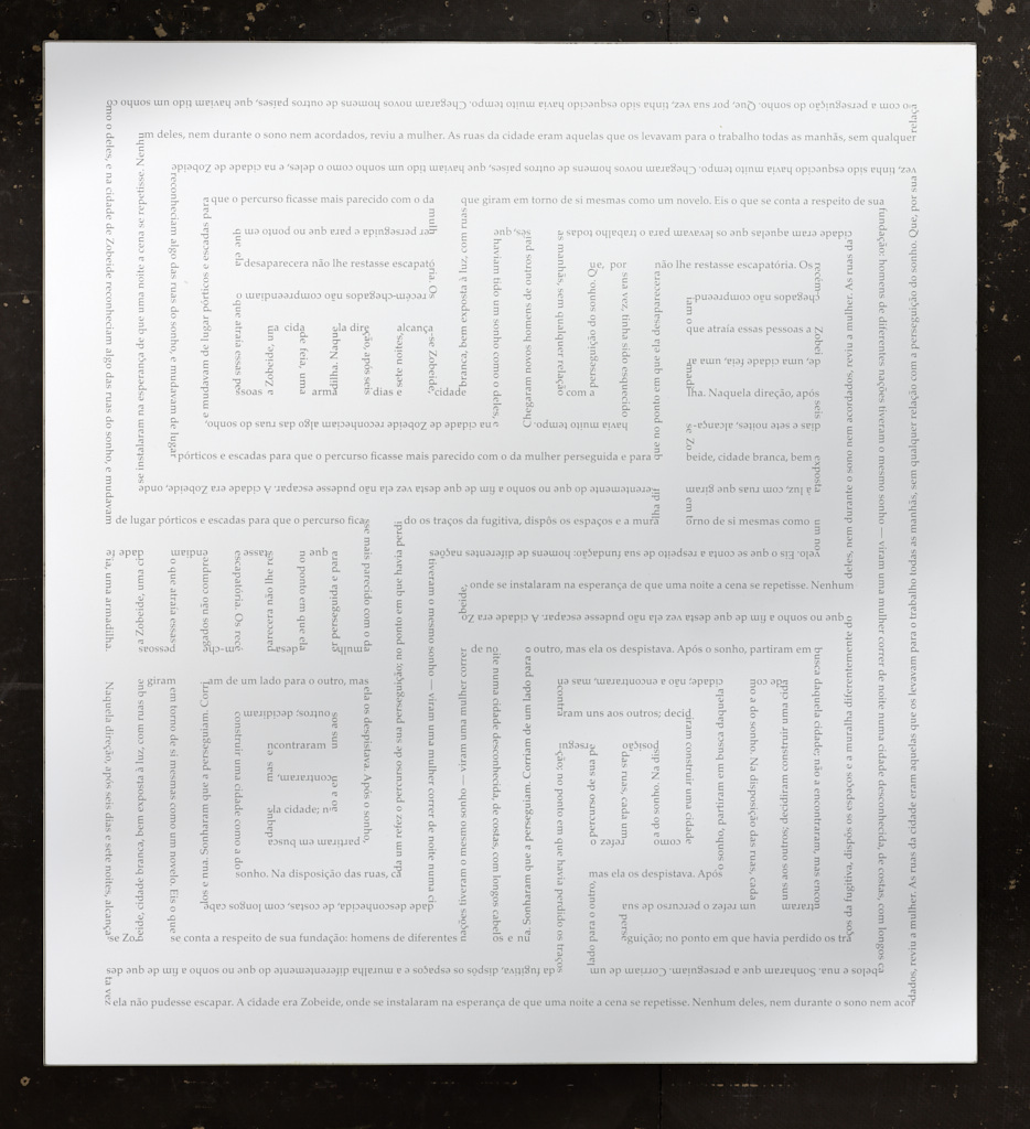 /Perfectly%20even%20maze-like%20geometric%20design%20on%20white.%20The%20design%20looks%20gray%2C%20but%20closer%20examination%20shows%20that%20it%E2%80%99s%20actually%20text.