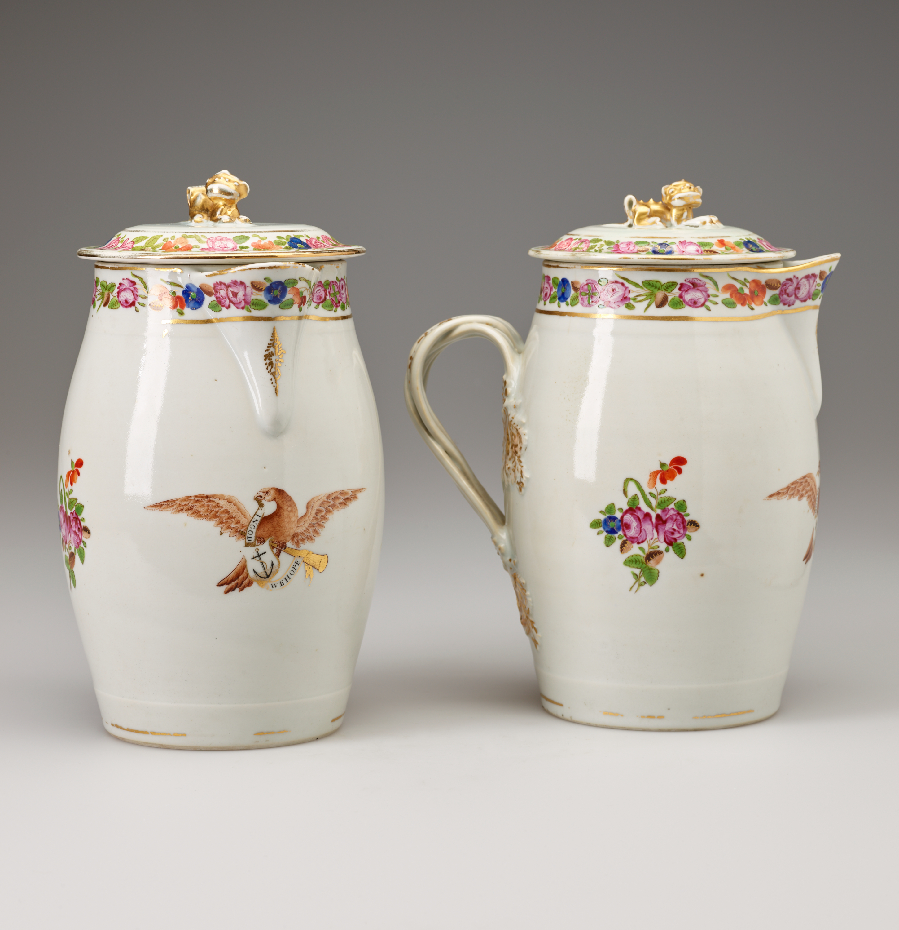 /Two%20cream%20colored%20lidded%20vessels%20with%20decorations%20of%20flowers%20and%20eagles.%20