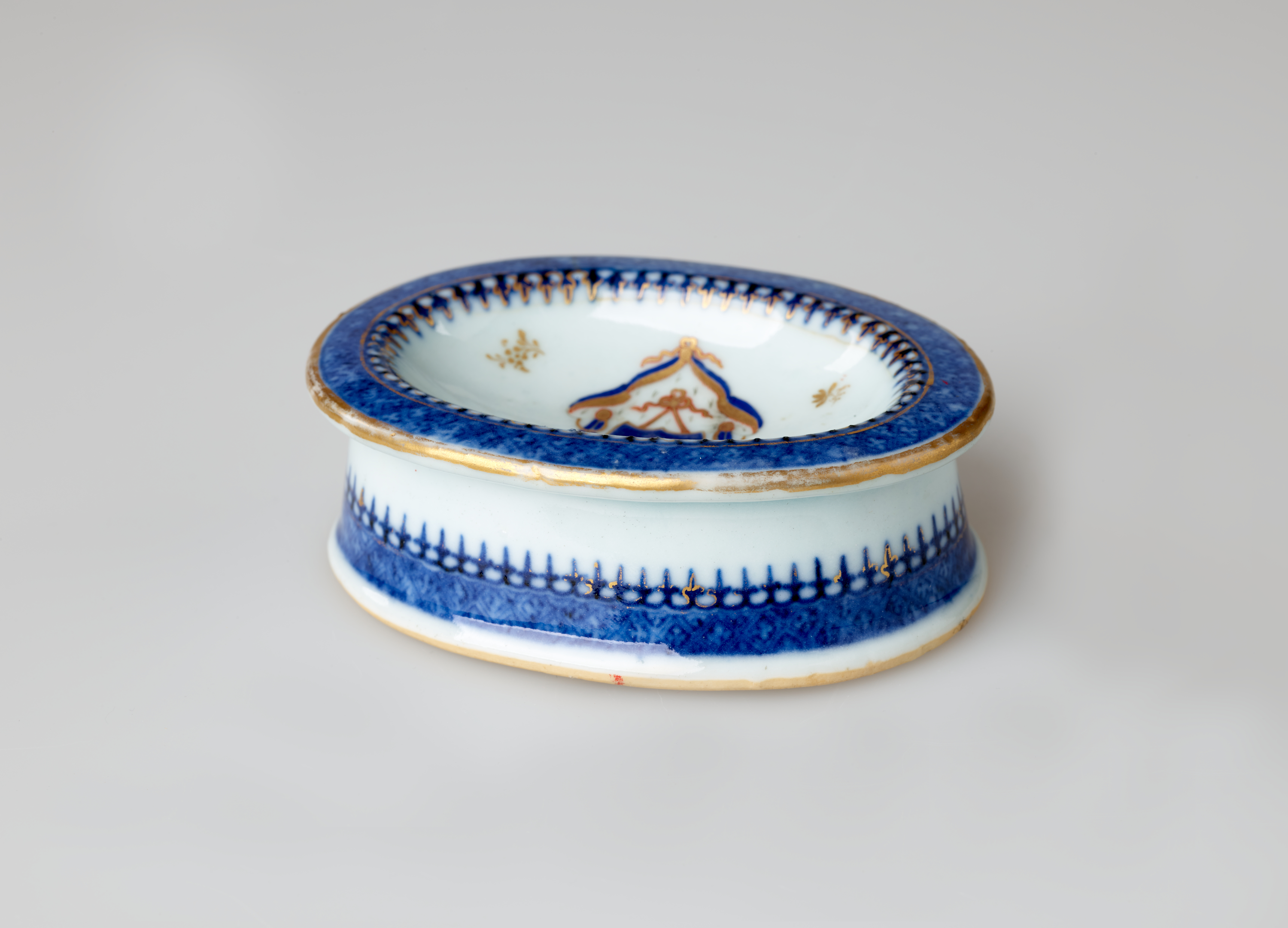 /An%20oval%20porcelain%20white%20salt%20container%20with%20blue%20and%20gilded%20decorations.%20