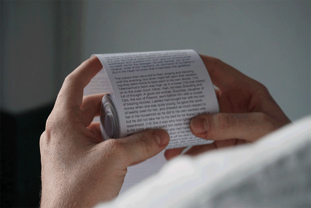 gif of a man reading a long paper scroll, taken from over his shoulder. the scroll is being navigated like a smartphone.
