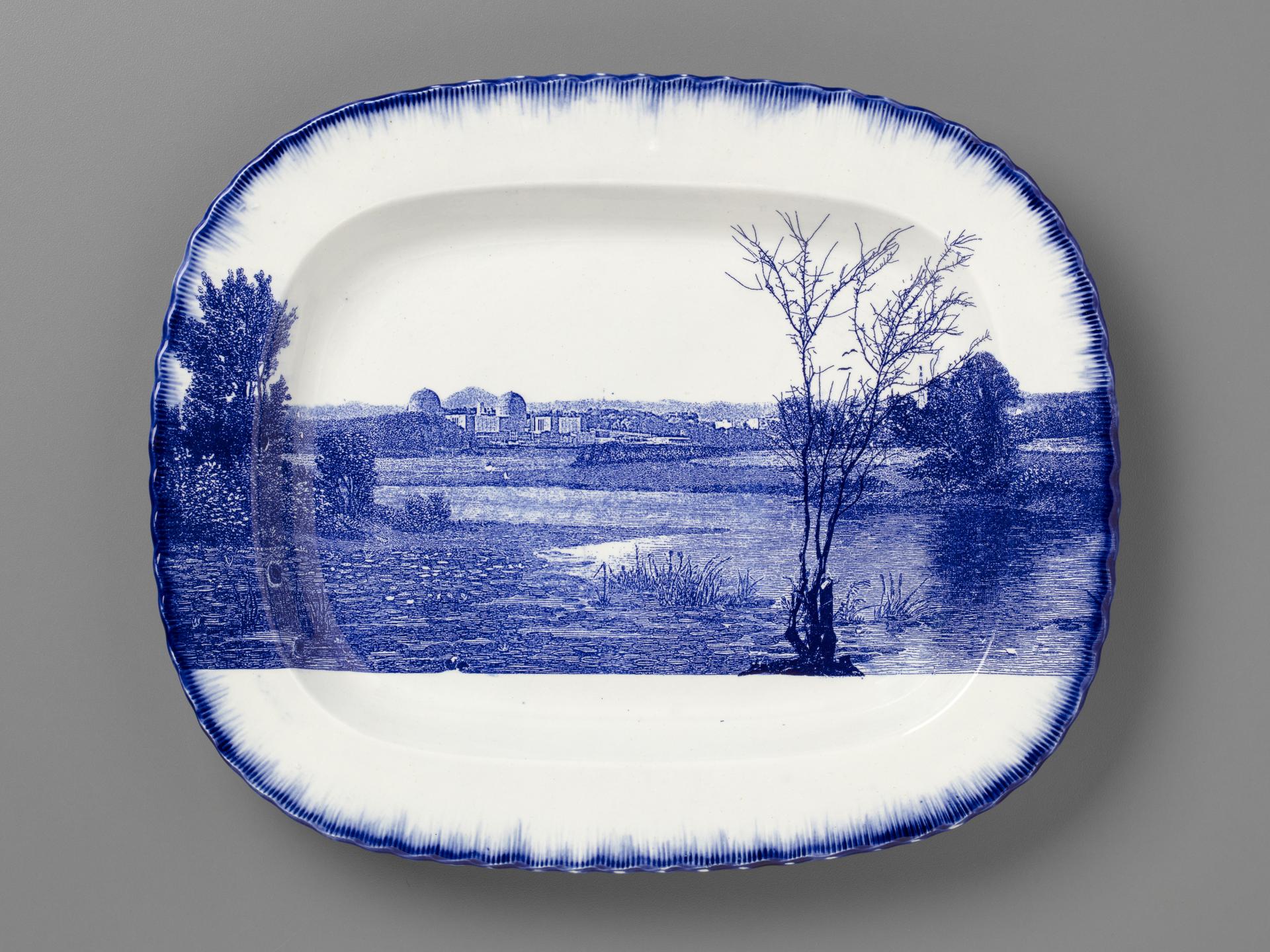 blue and white transferware platter with the Indian Point power station