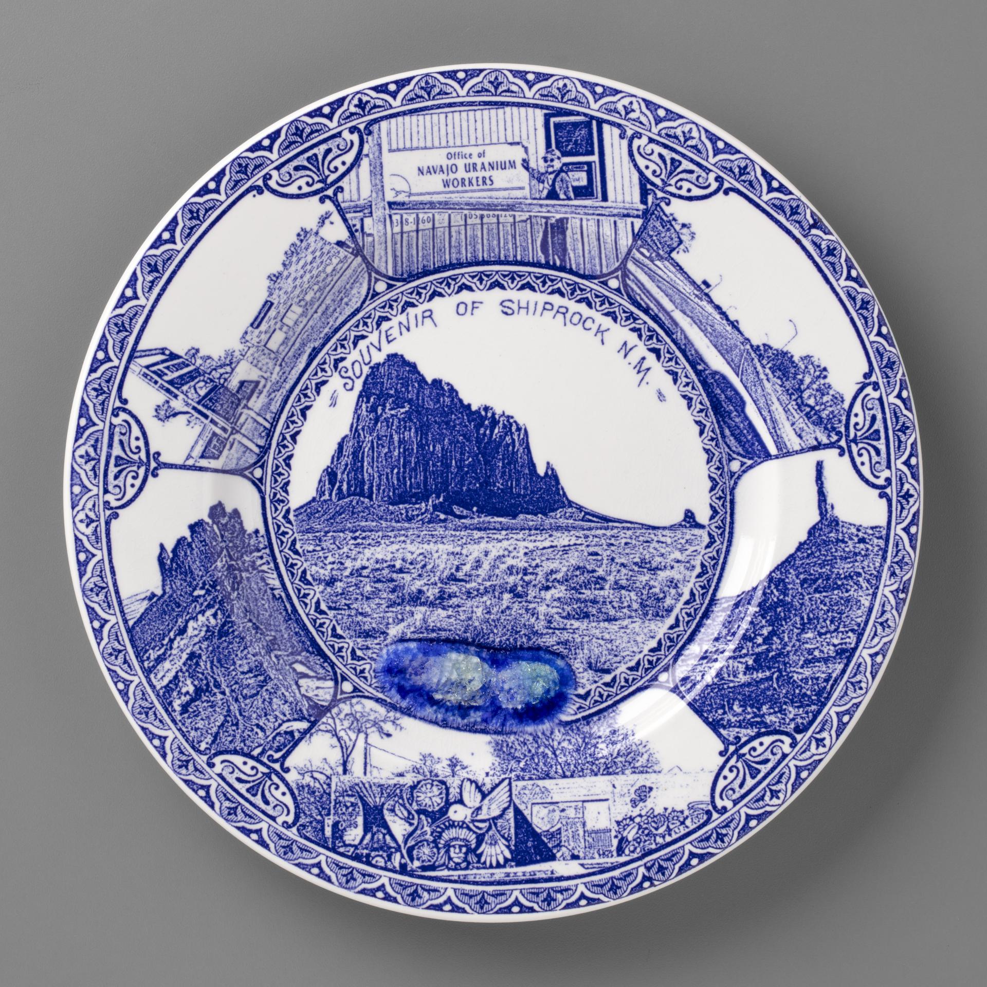 blue and white transferware plate depicting a scenes near Shiprock, NM