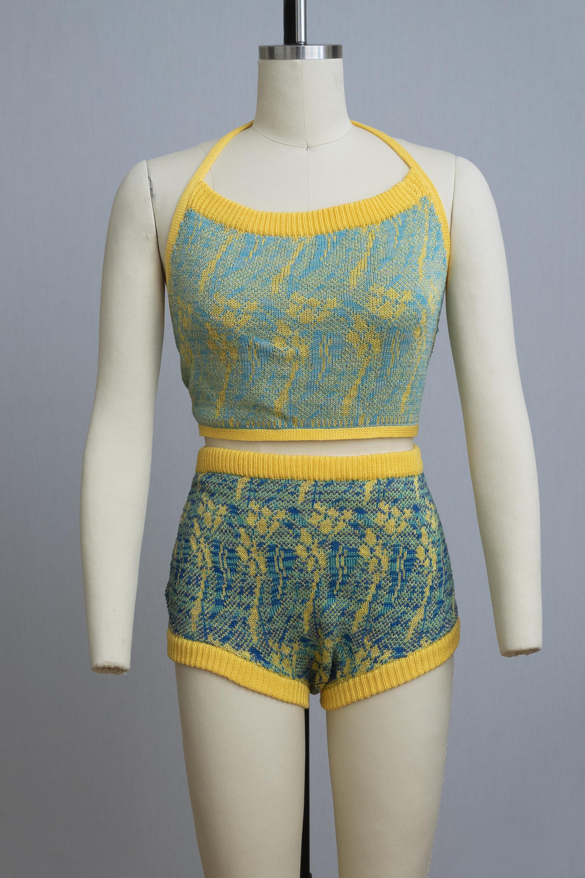 dress form wearing a knit playsuit in blues and yellows