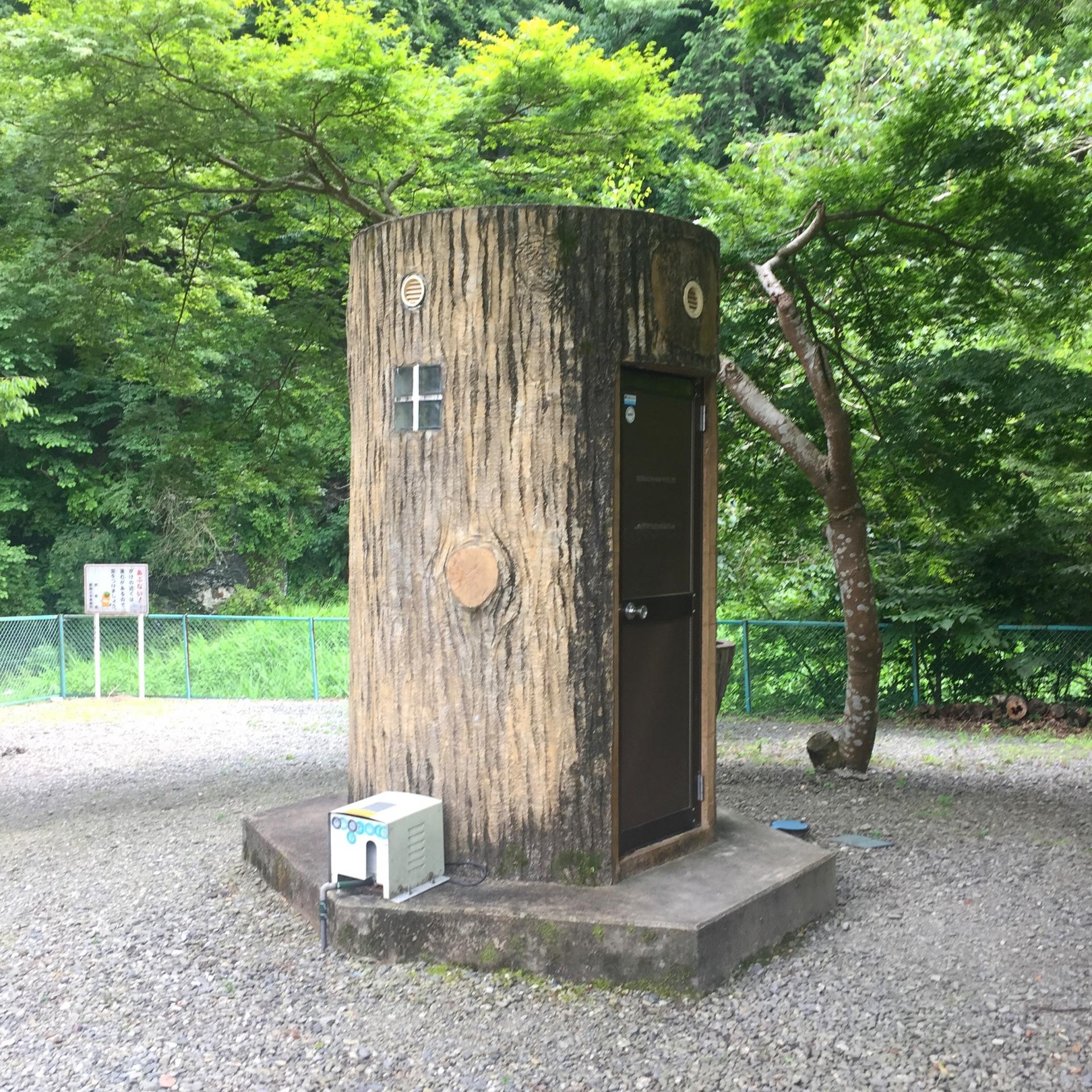 Utility shed made to look like a large tree stump