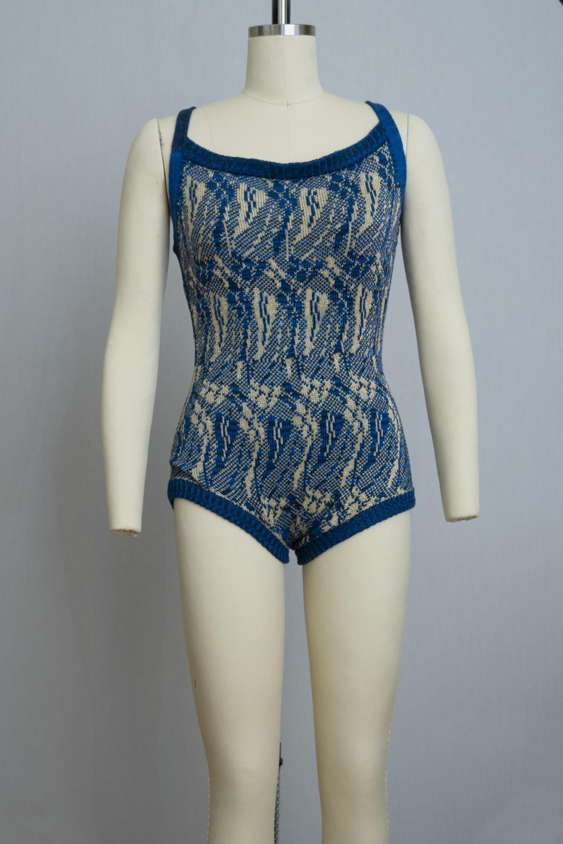 dress form wearing a knit playsuit in blues and yellows