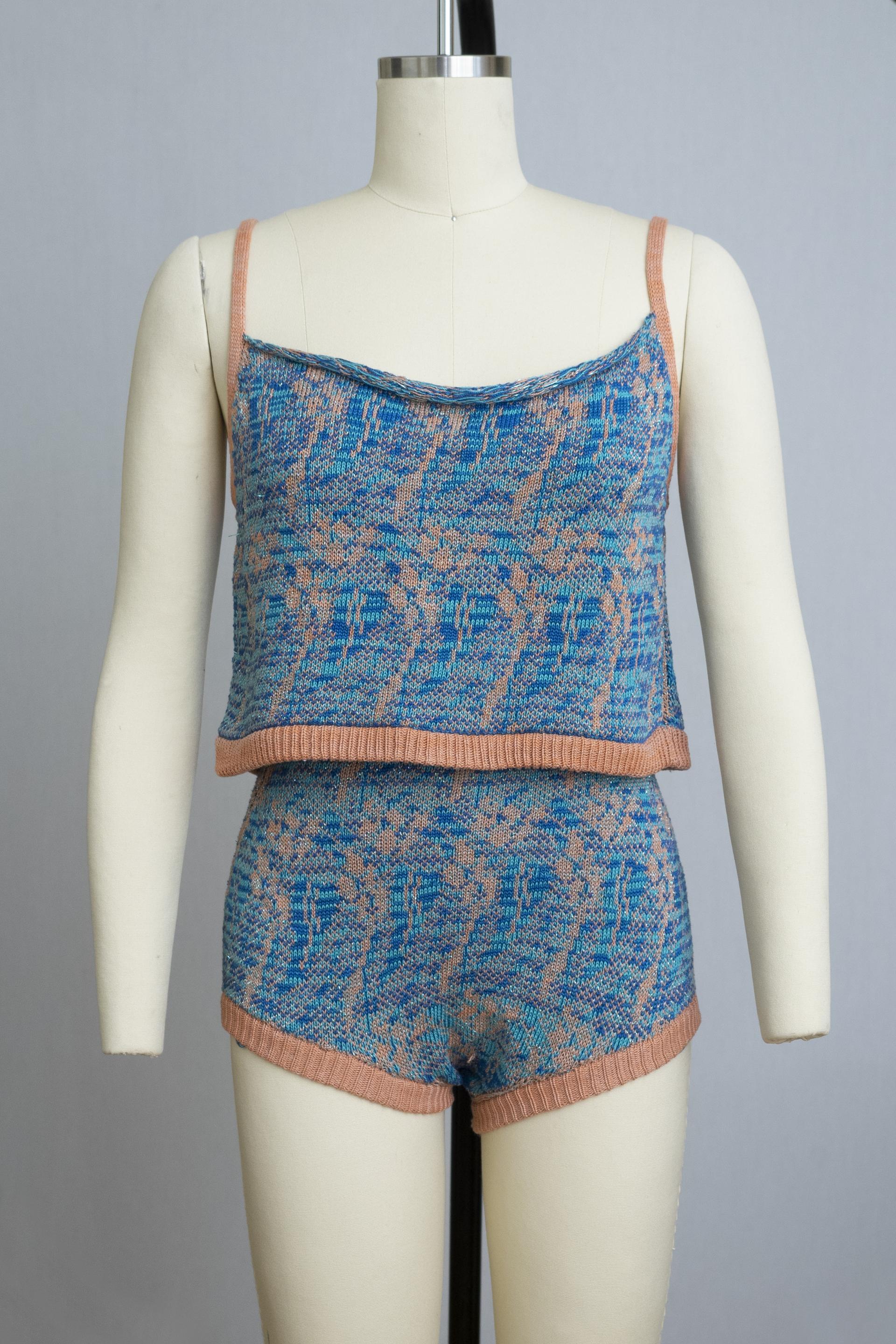 dress form wearing a knit playsuit in blues and pink