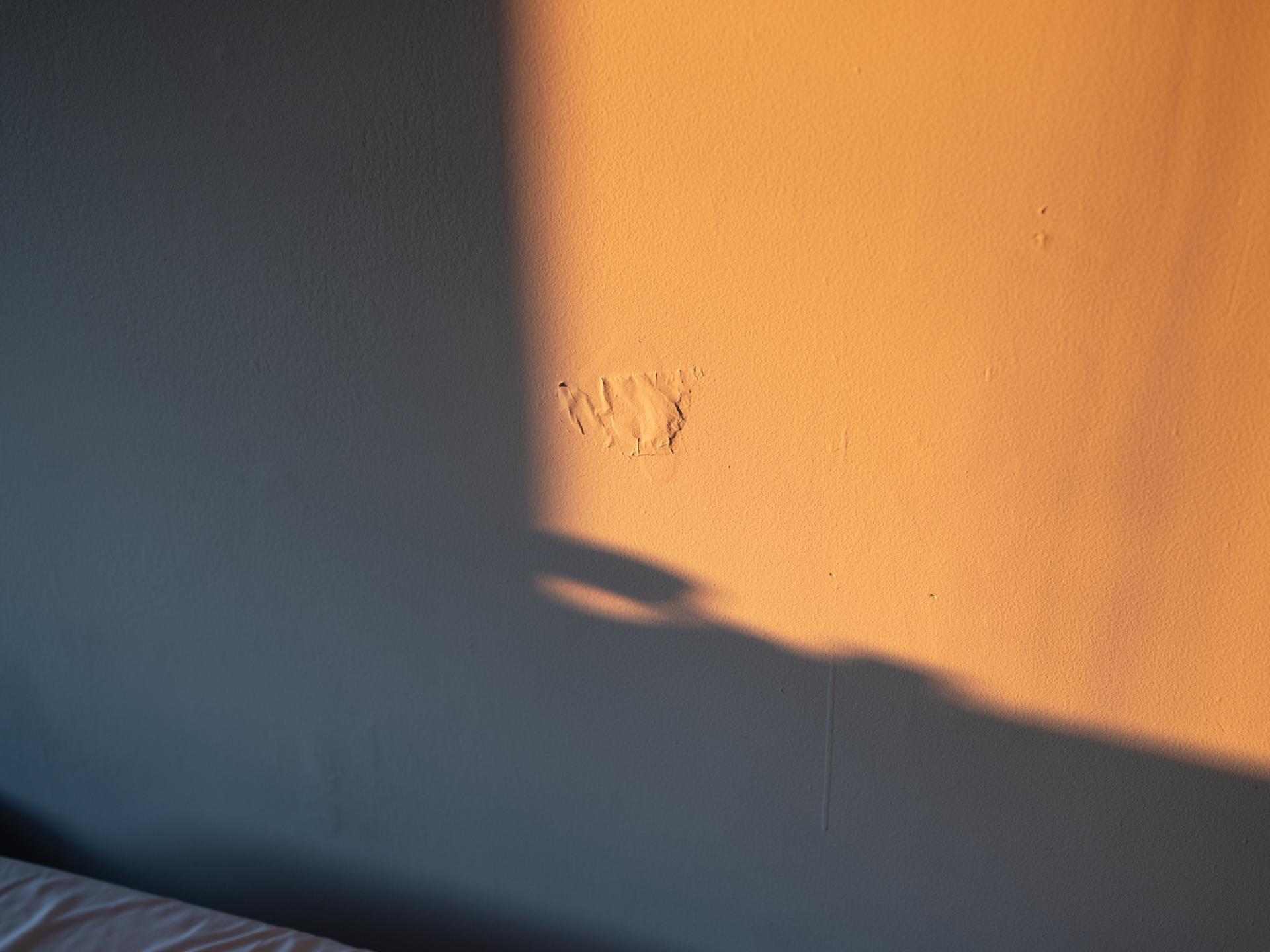 mark on bedroom wall with sunlight