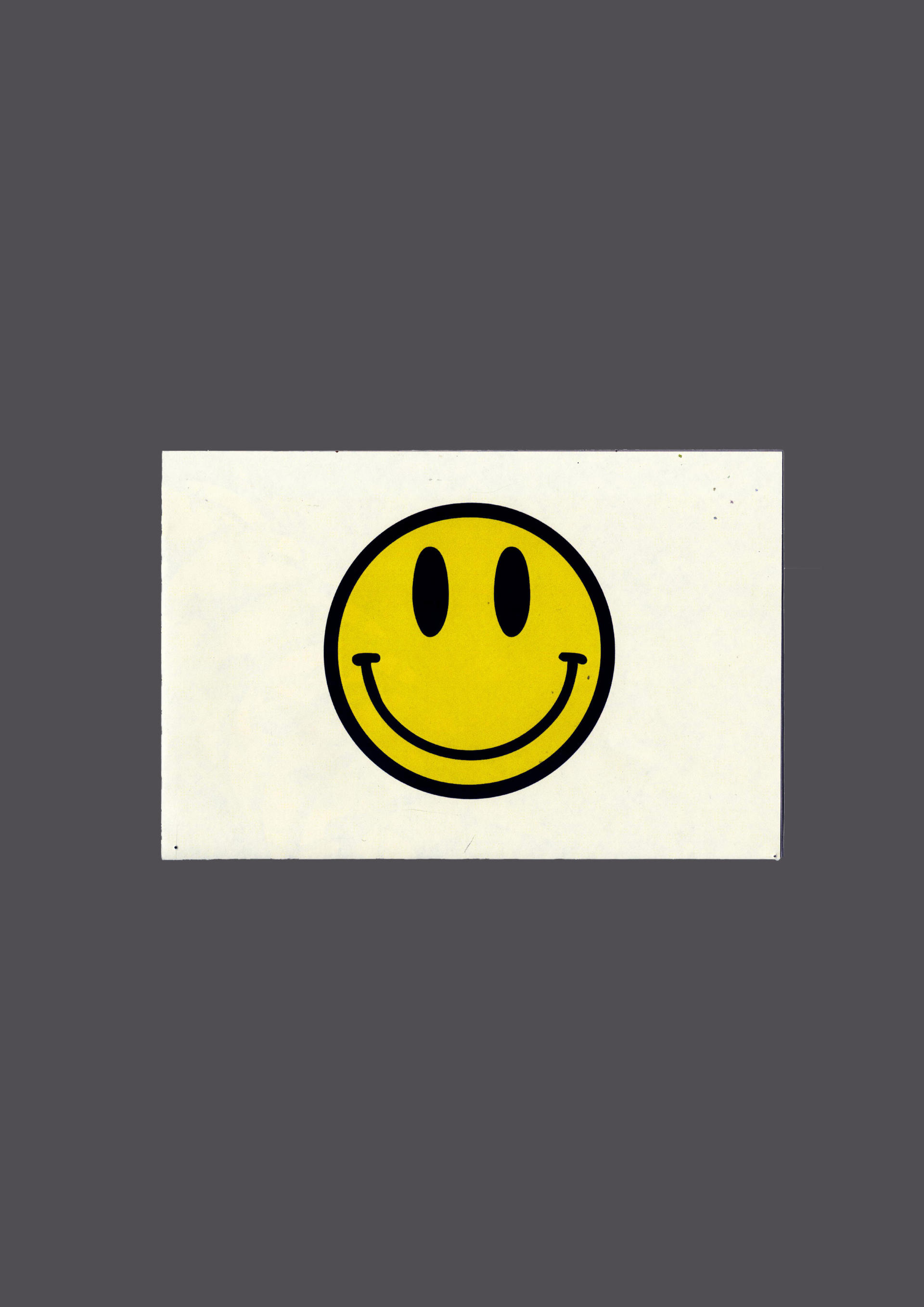 Smiley face graphic with white rectangle behind