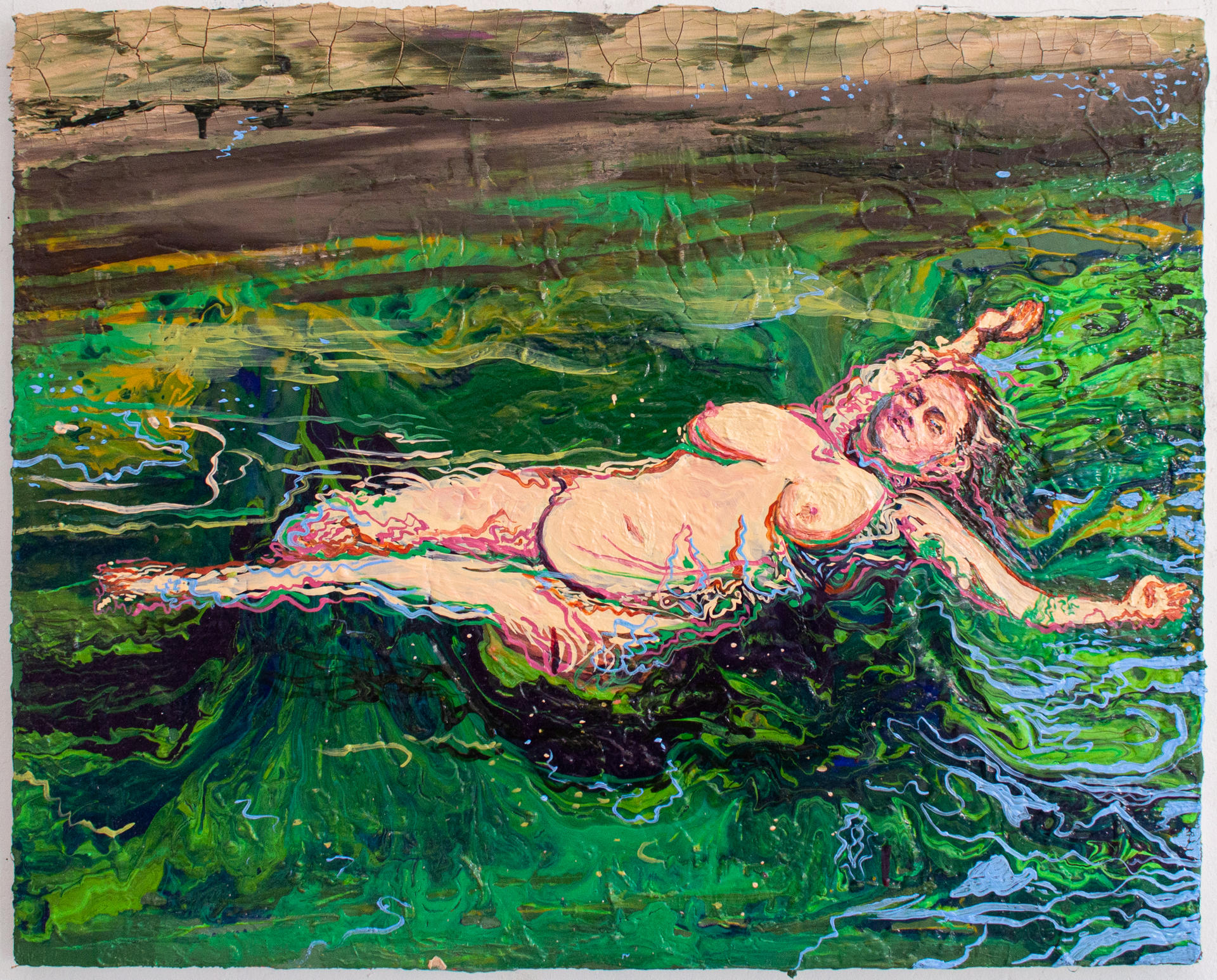 Nude figure floating in fresh green waters