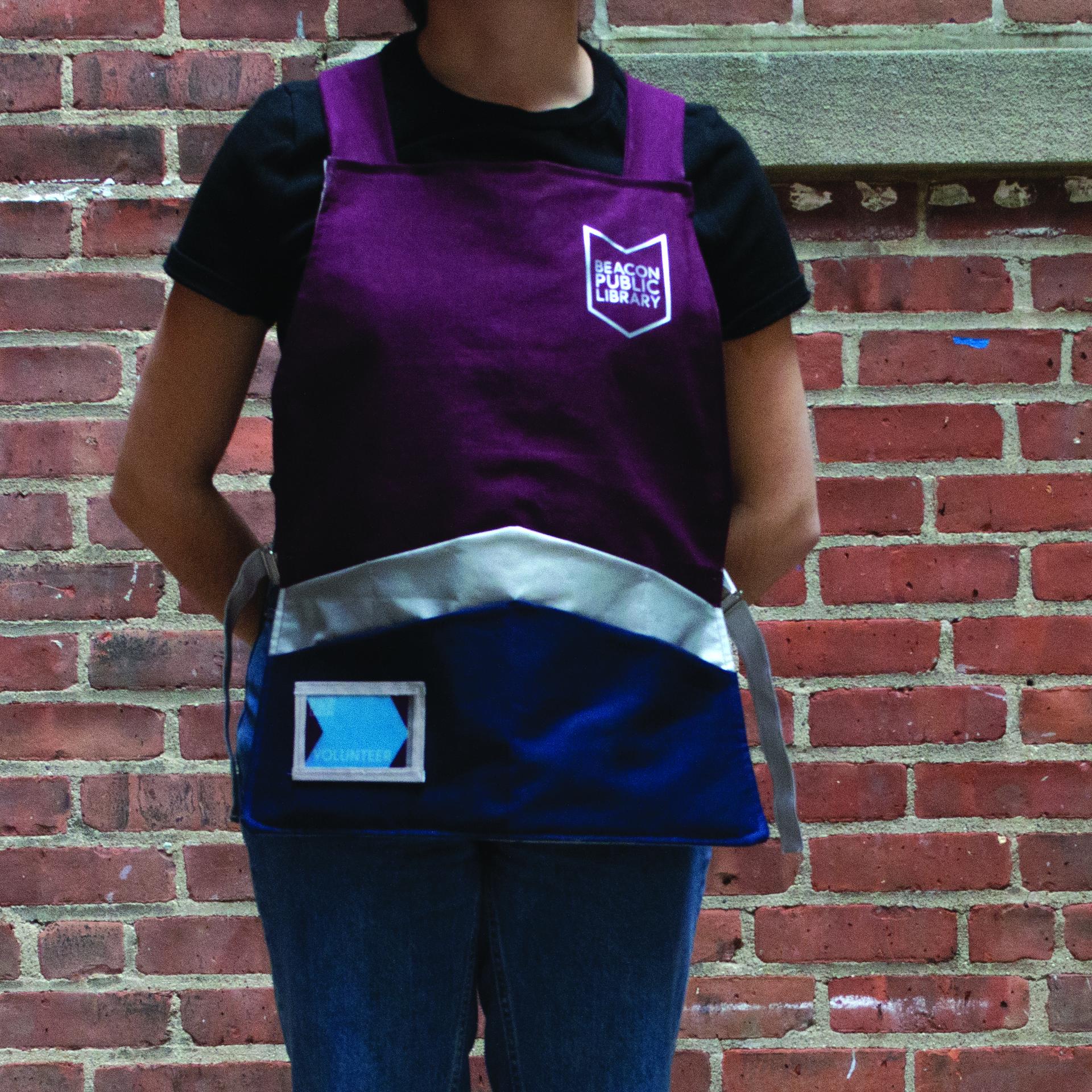 Wearing the library apron