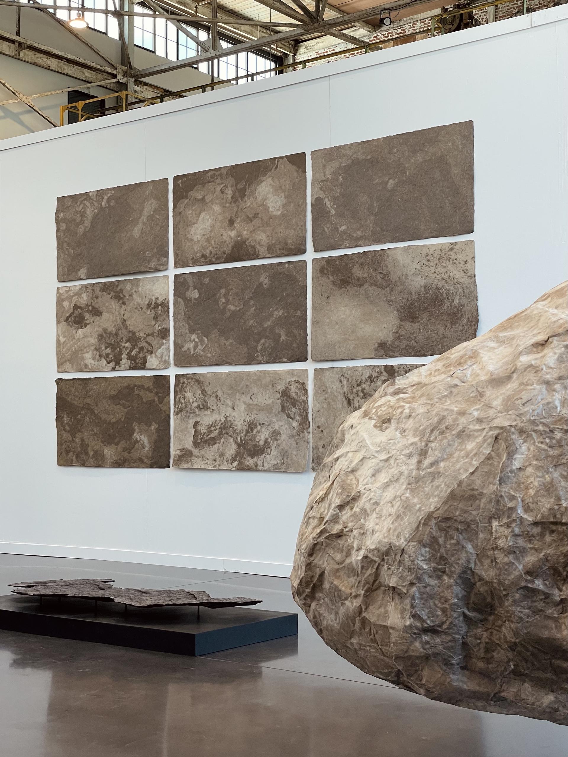 image of waterfire art center with pulp paintings, paper cast and boulder in view