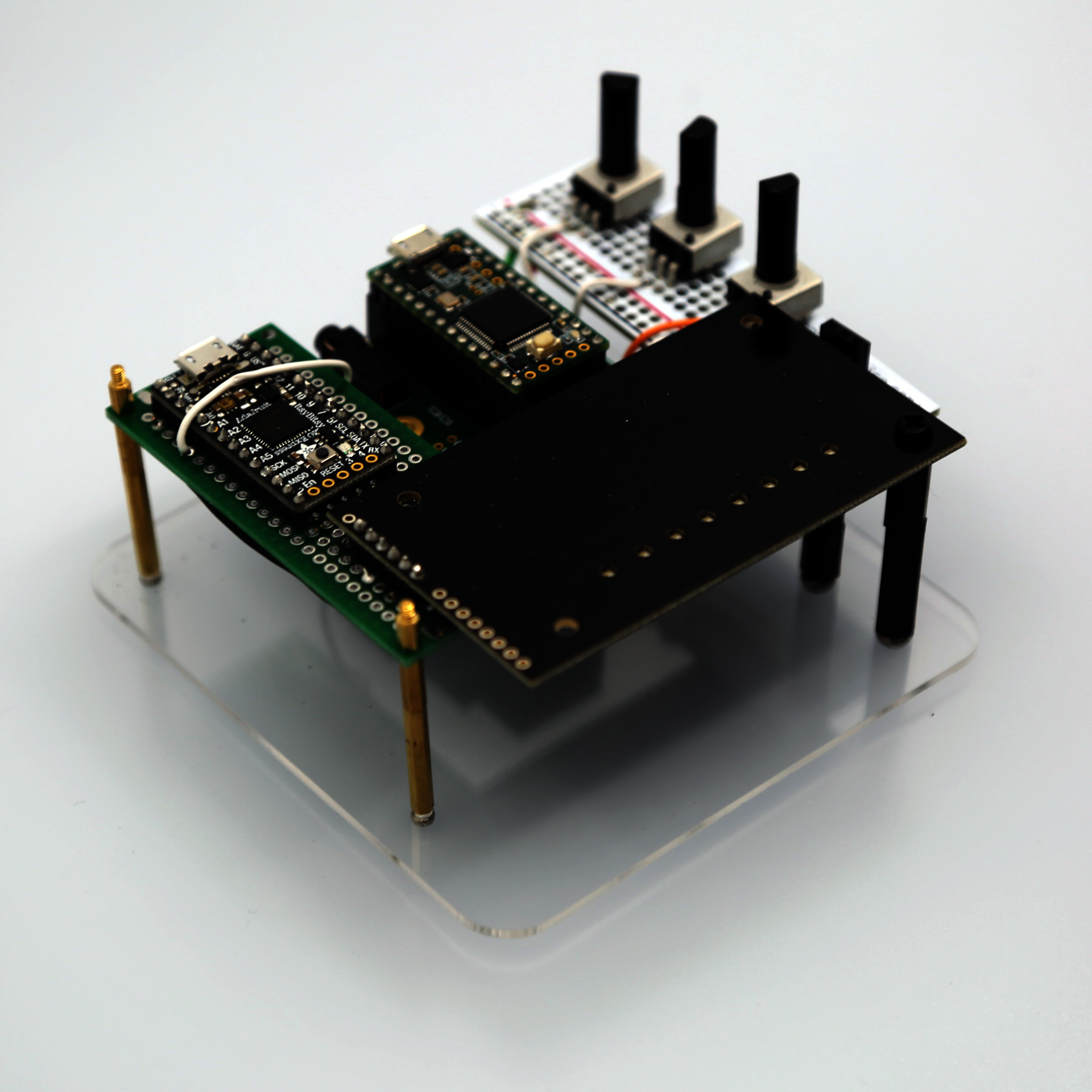 Image of an instrument consisting of circuit boards and small electronics components wired together.
