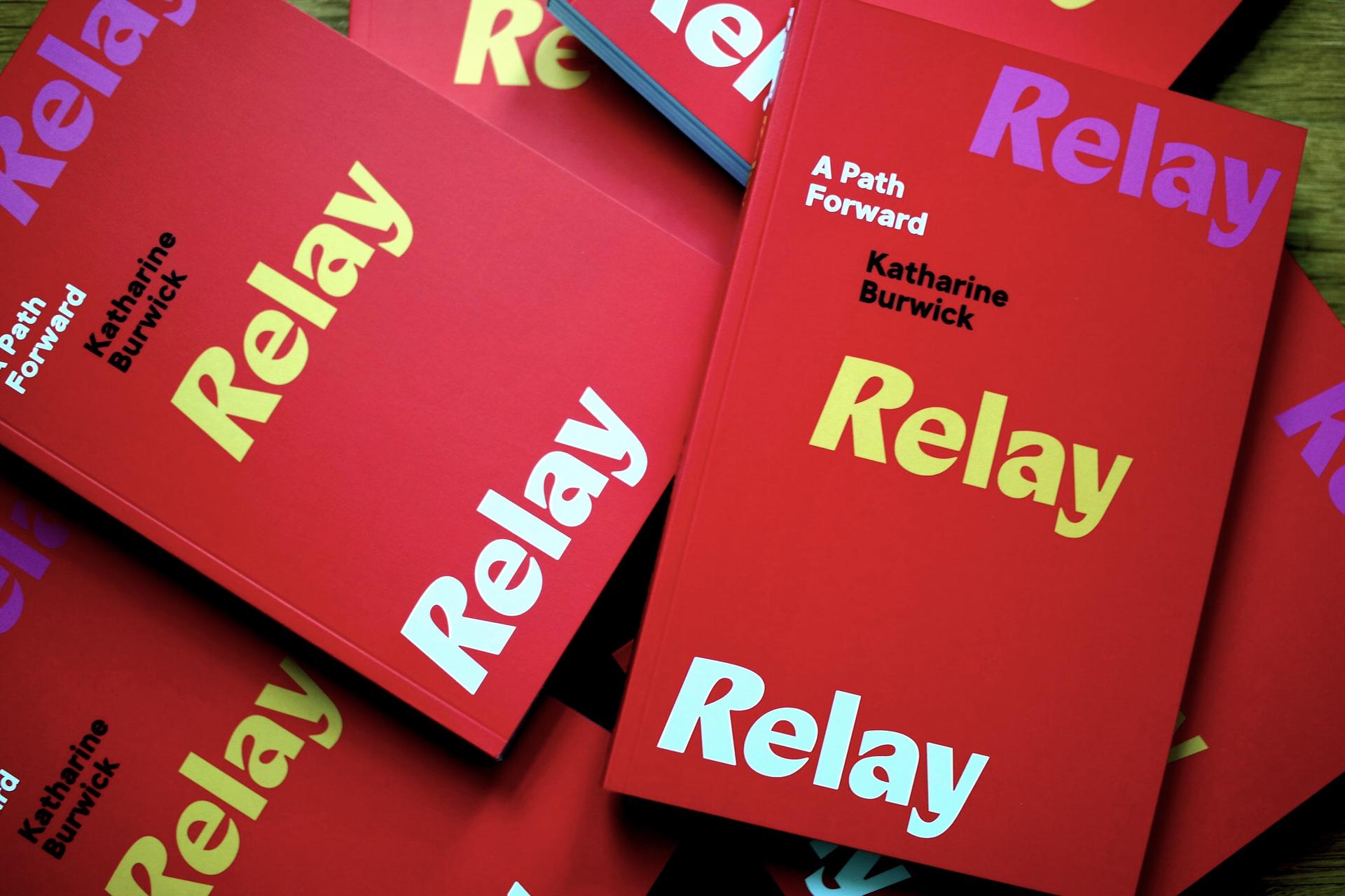 Stack of red books with "Relay" repeated 3 times, and "A Path Forward" with the author's name in parallel