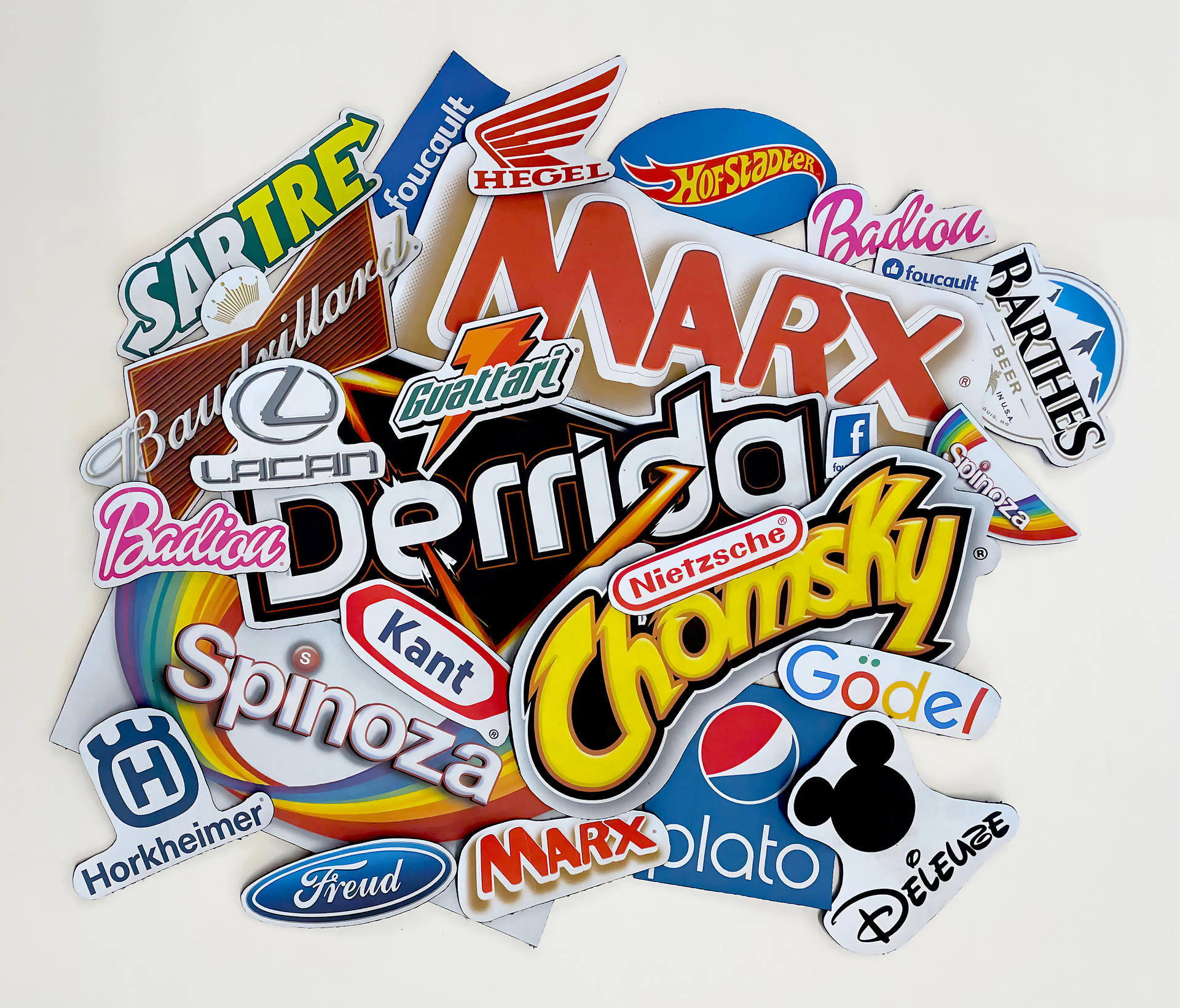 A stack of patches with logos of common brands edited to replace the brand name with a theorist's name.