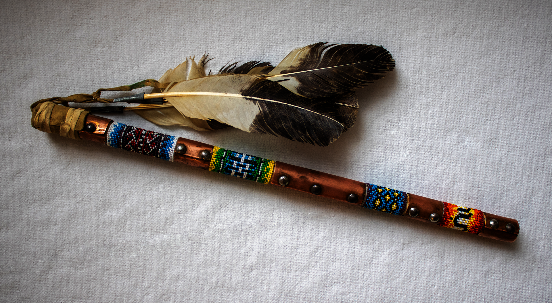 A re-beaded talking stick made to facilitate talking circles.