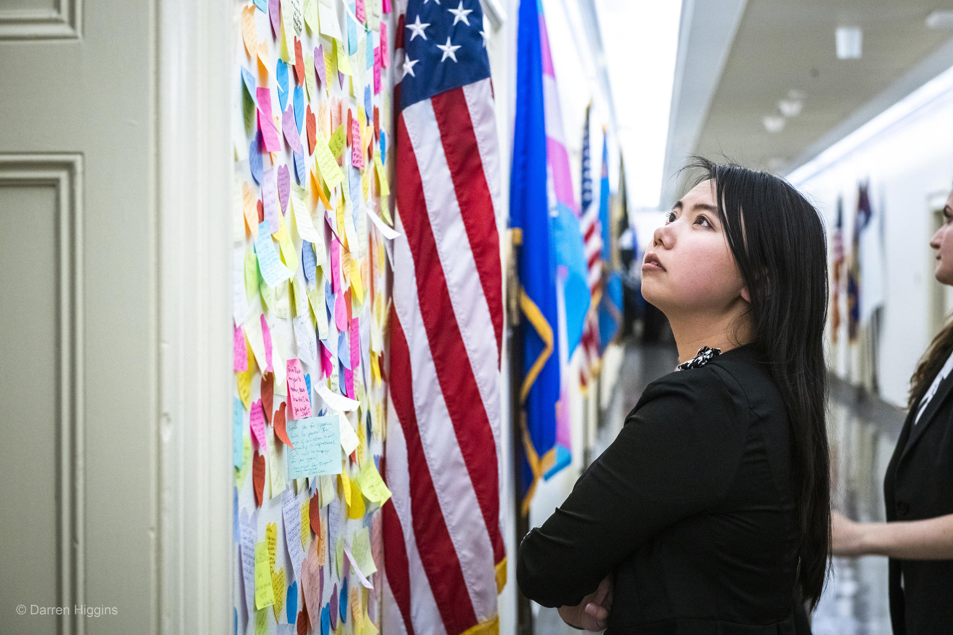 World Wildlife Fund activists gather around post it notes stuck to a door 