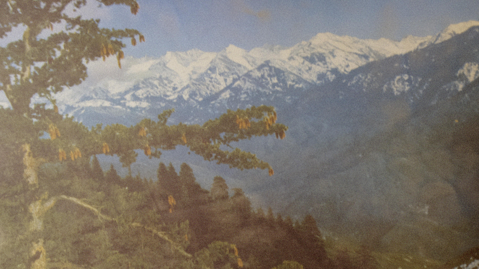 A close up of a picture depicting a mountain scene. 