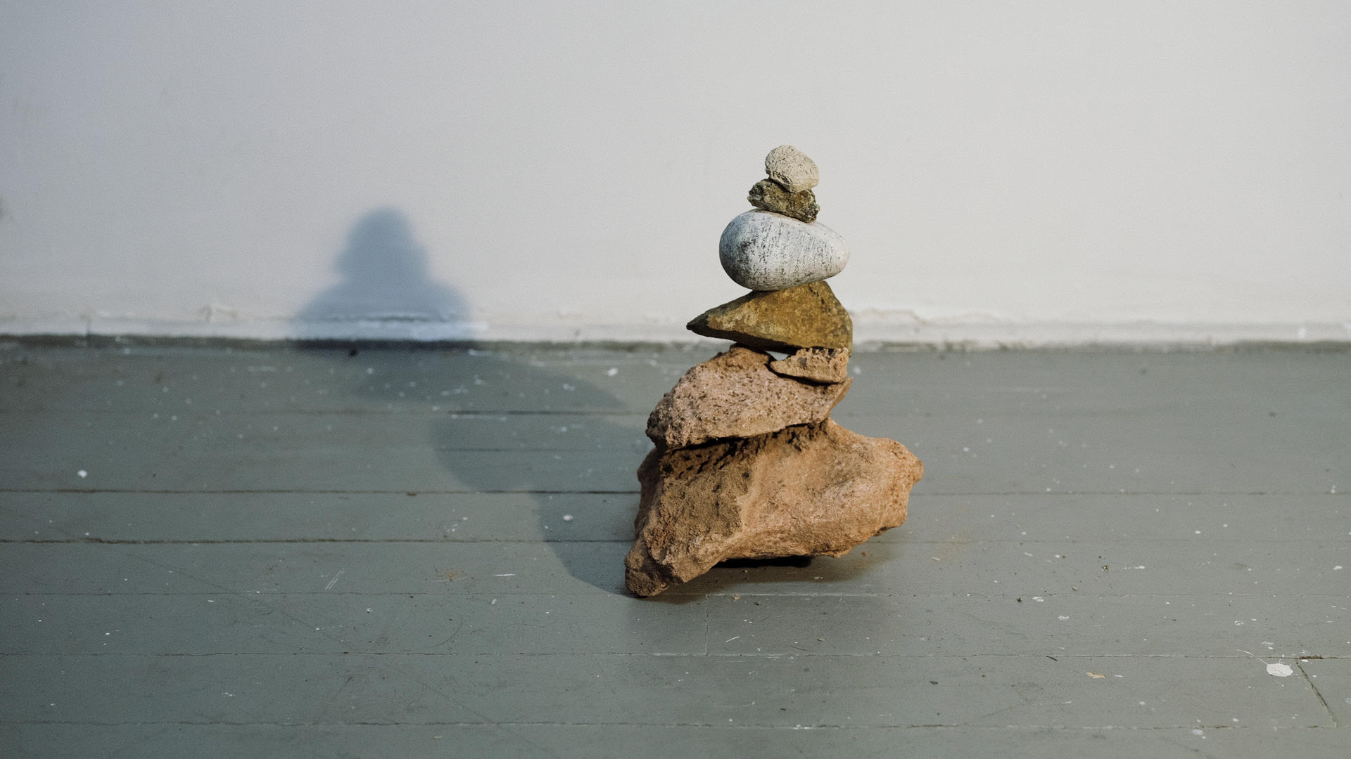 A pile of rocks in the shape of a cairn, or navigation sign. 