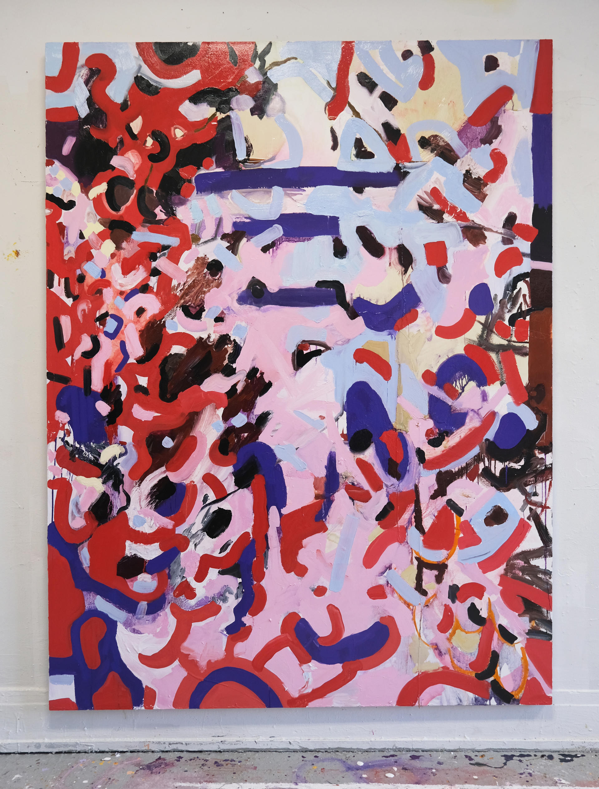 A vertical abstract painting with a red, pink, purple, and blue color pallet. 
