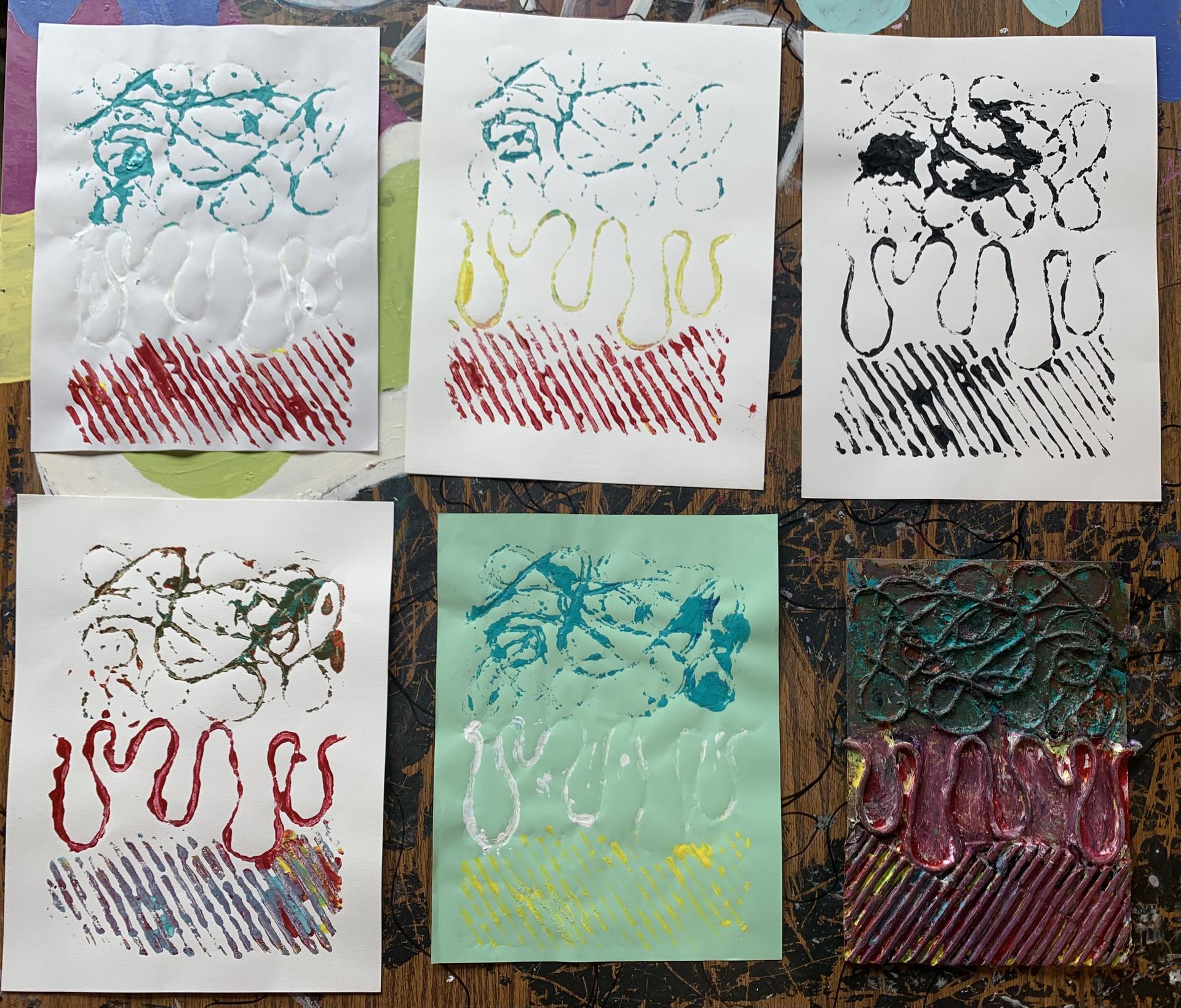Various colored prints made from a collagraph plate. The theme was centered around music and what it means to them. In this student’s case, he connects with various genres and used a variety of lines to replicate how they feel to him.