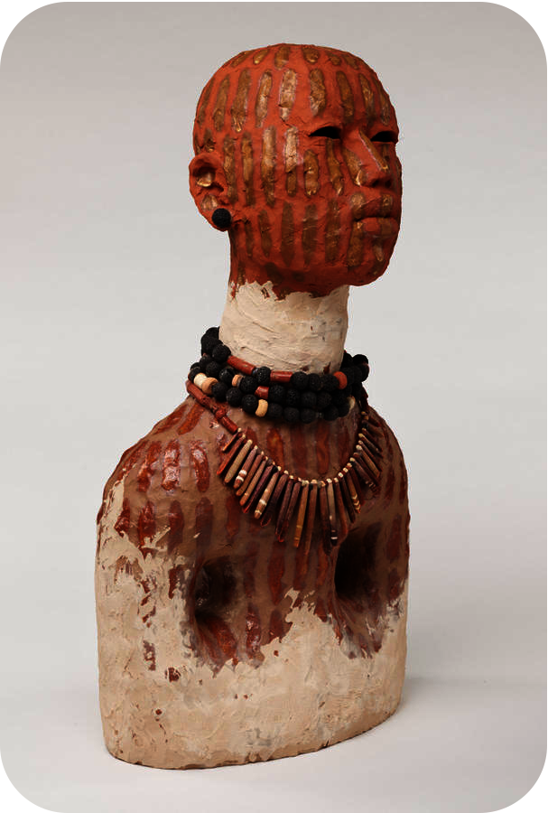 Clay bust featuring a terracotta head with golden stripes of paint, a white neck with black and brown beaded necklaces, and a terracotta striped bust with white at the base. 