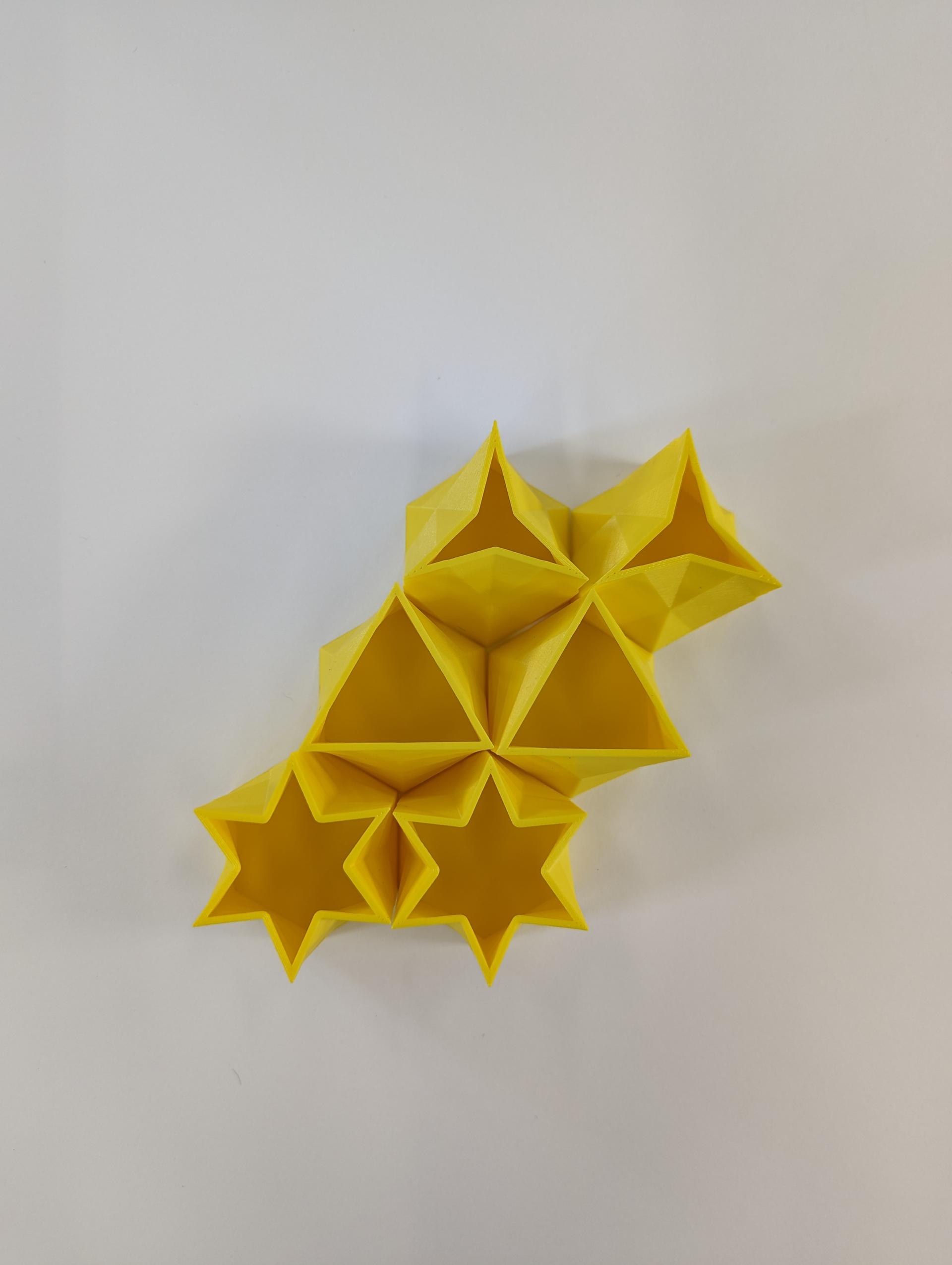 Small 3D printed extrusions translate from hexagons to triangles and other shapes.