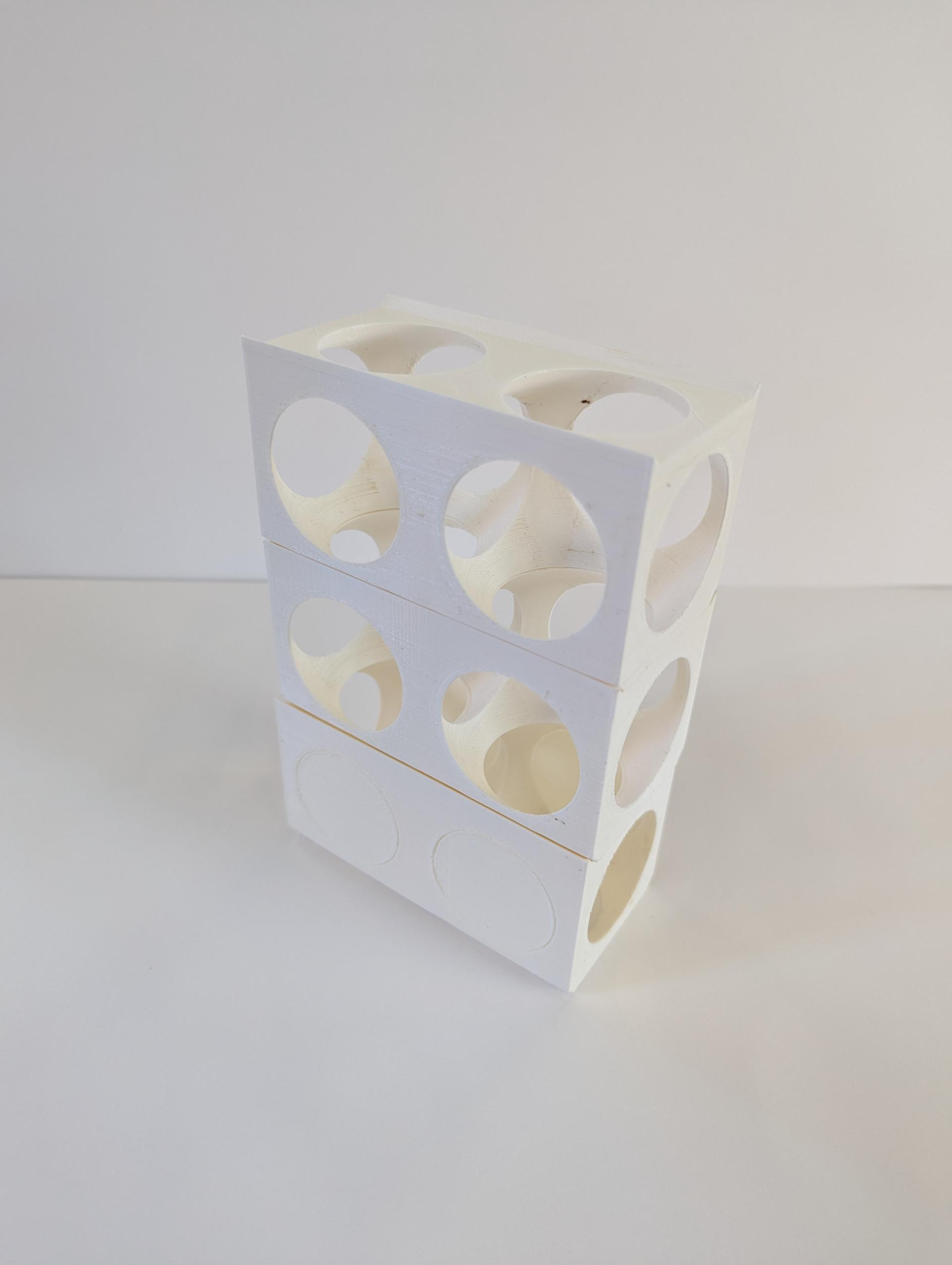 3D printed rectilinear block is voided via 2 spheres to create a skeletal frame.