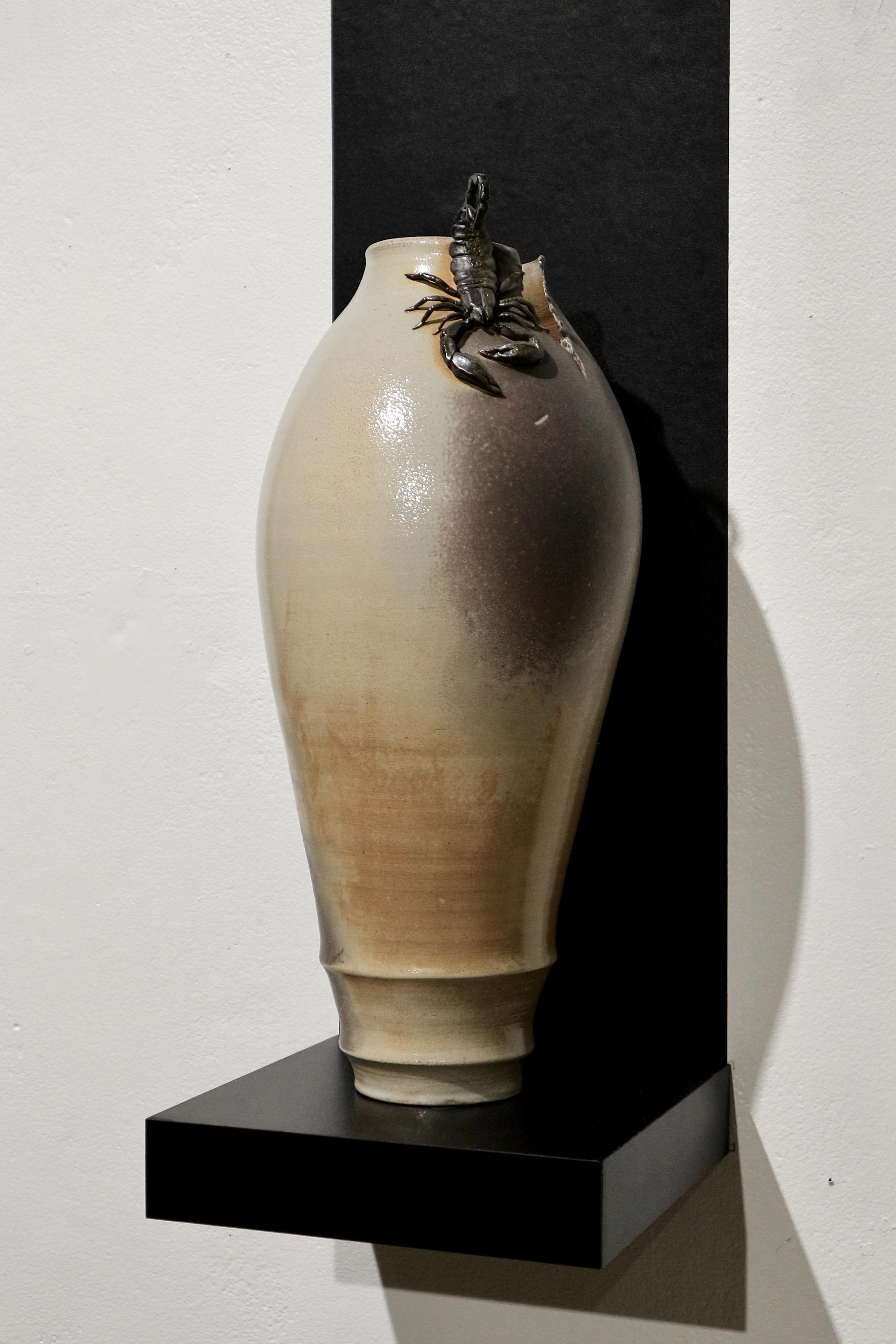 Soda-fired ceramic vessel with hand-sculpted scorpion around the neck.