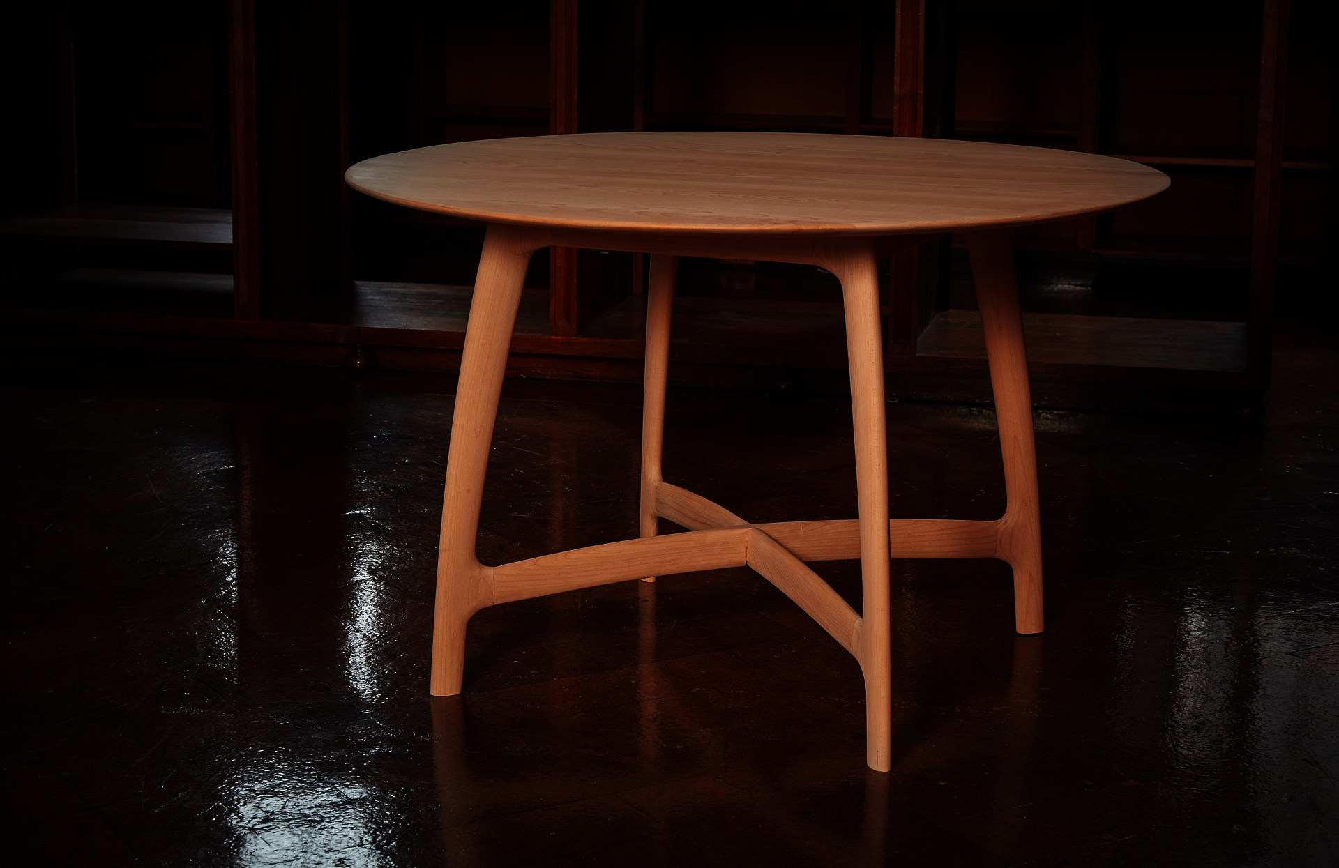 Beech wood dining table with library background