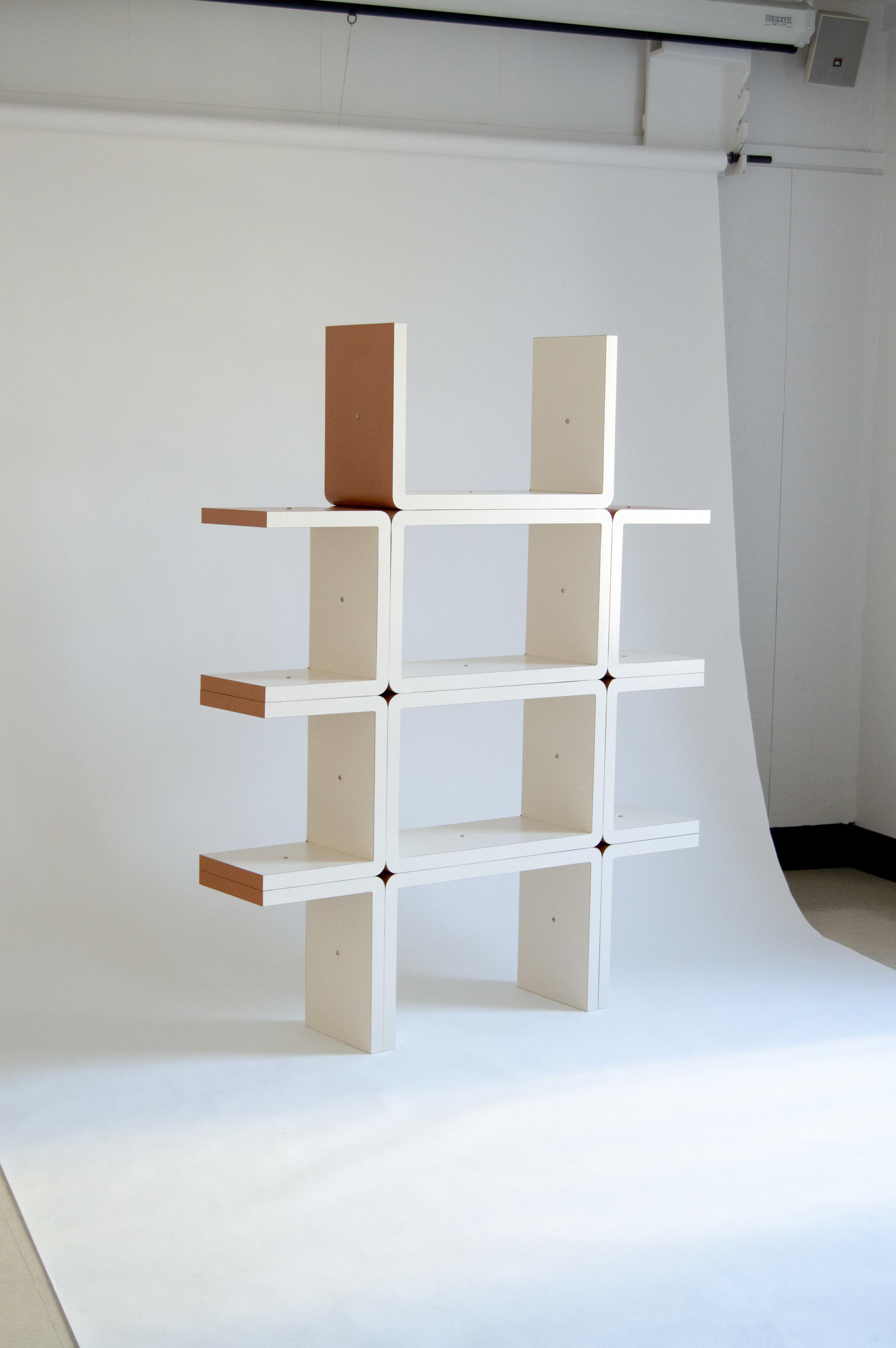 A modular shelving system that re-considers design and architectural references from the 60s/80s in a contemporary context.