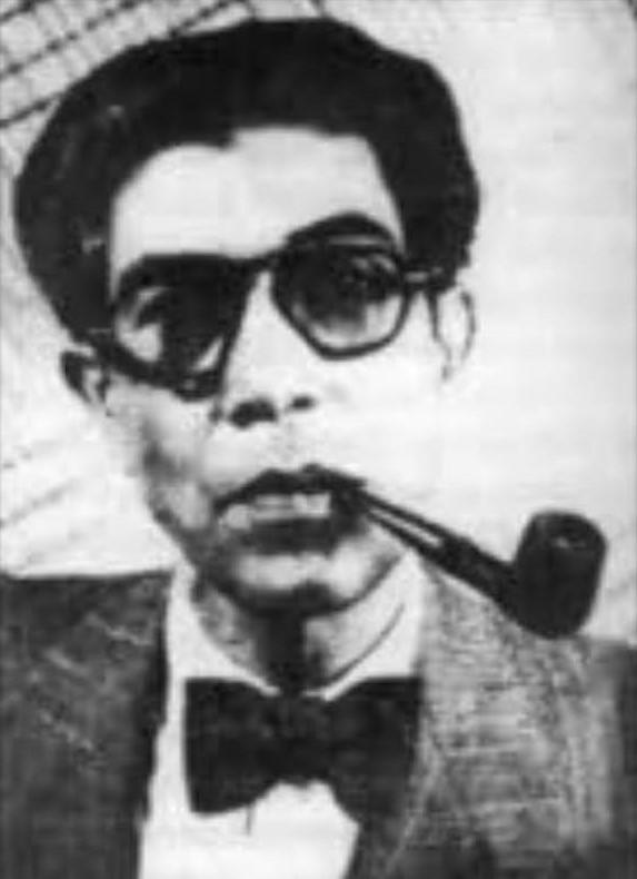 A portrait of Ahmed Ali smoking a pipe, circa 1955