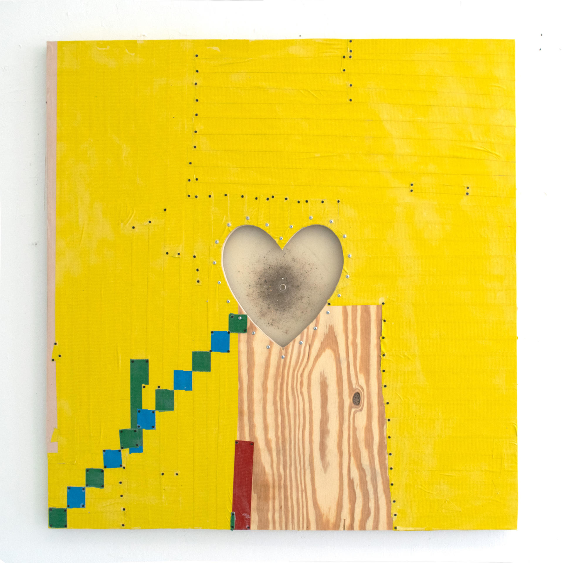 A silicone heart shape dominates a wood panel, skinned in yellow duct tape, the seams of which are sealed with black furniture tacks.