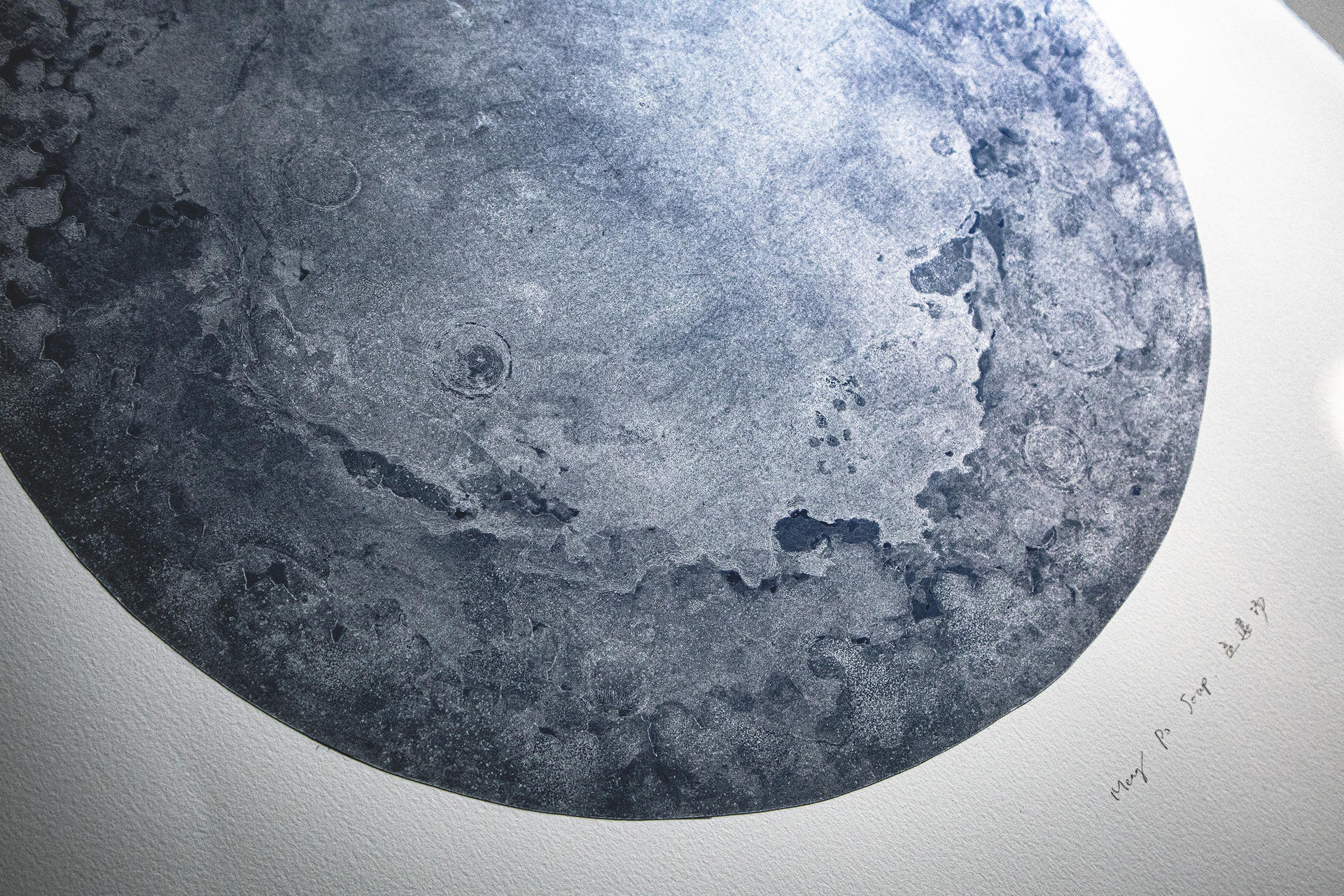 Detail of the silver moon, you can see the fog-like dark blue craters and silver plains.