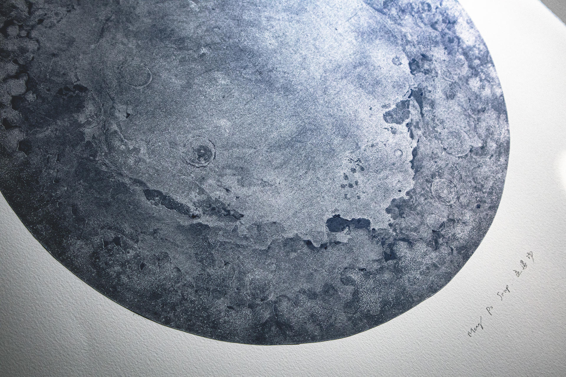 Detail of the silver moon, you can see the fog-like dark blue craters and silver plains.