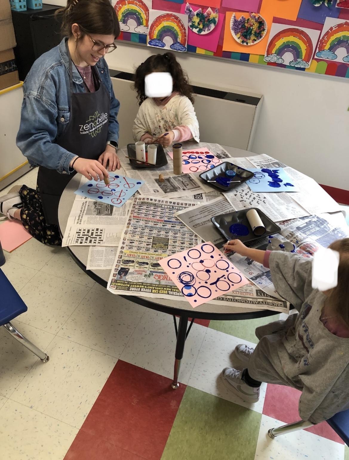 Pre-K students at Colt Andrews Elementary School explore recycled materials to create prints. Photographed by Lynne Ramos.