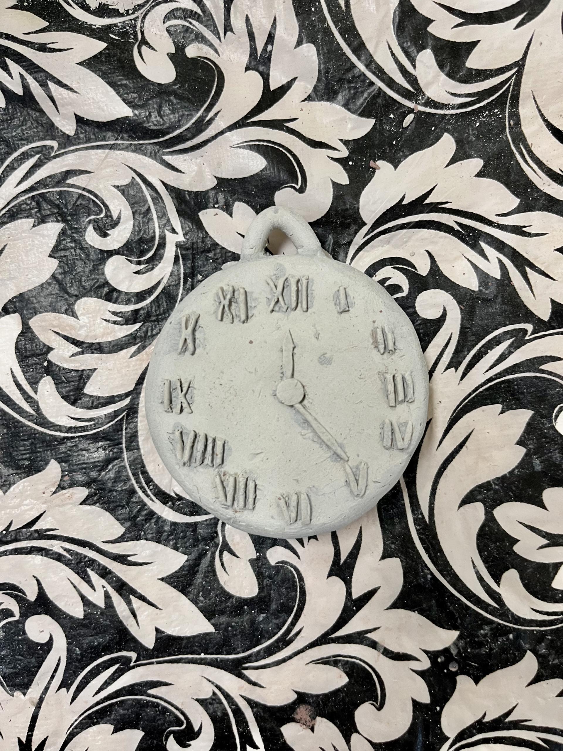 Pilgrim High School student creates ceramic pocket watch (in-progress).