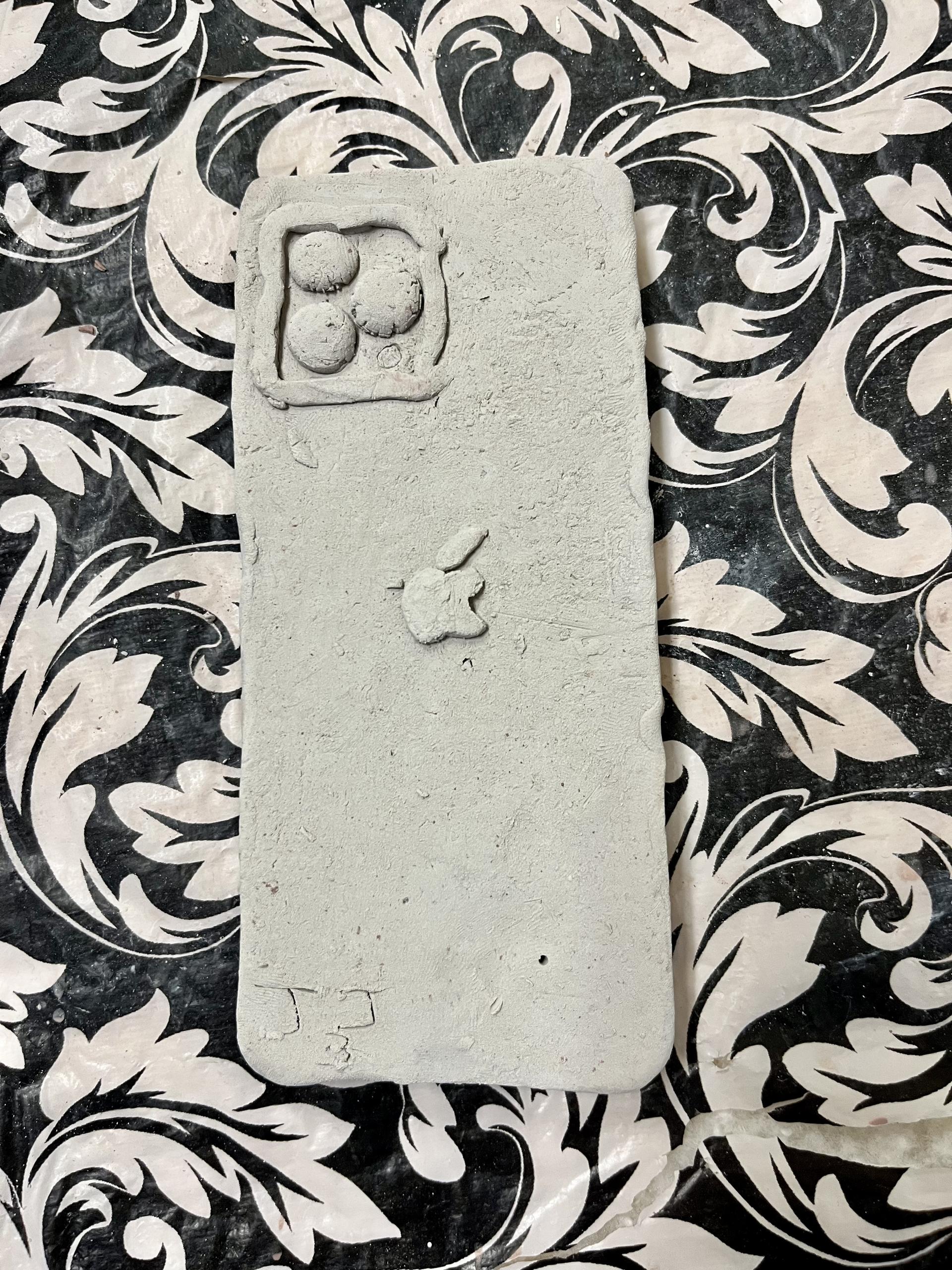 Pilgrim High School student creates ceramic iPhone (in-progress).