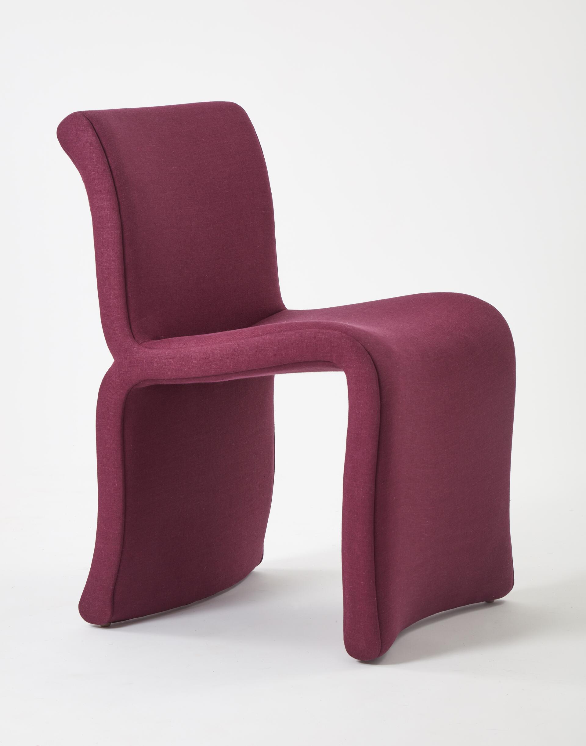 A modern upholstered dining chair with a deep purple belgian linen fabric featuring curved lines and no armrests