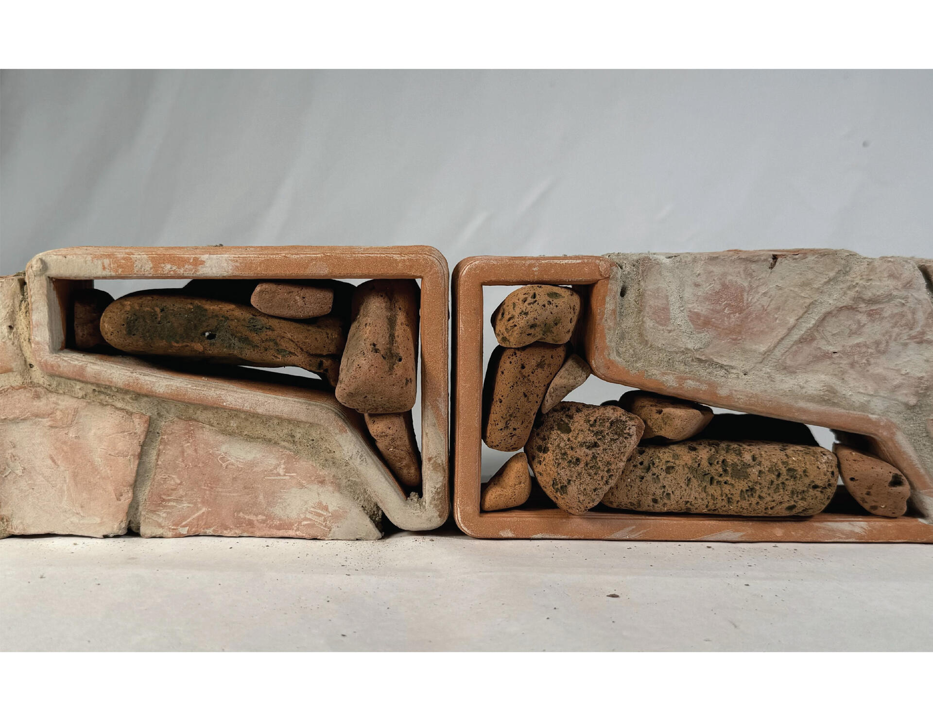 Image is of a prototype of the the brick themselves showing how the rubble is stacked within the form.
