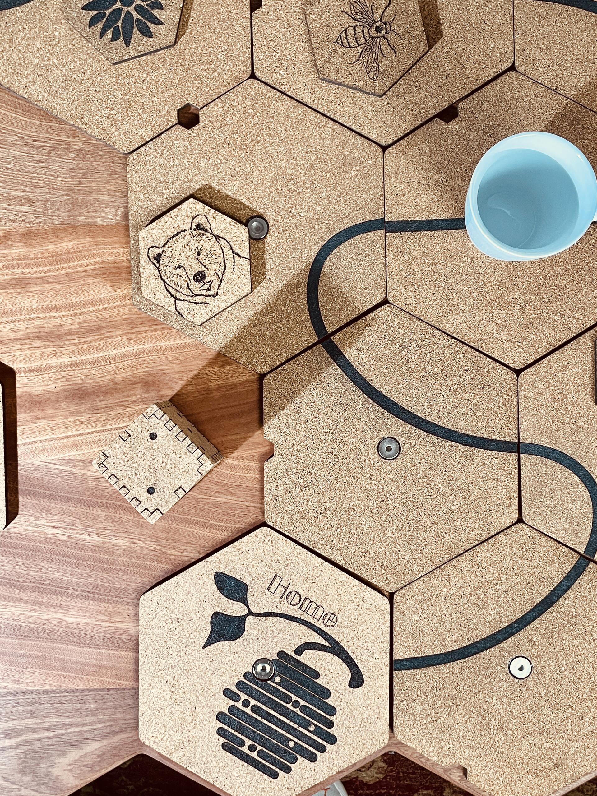 hexagon cork tiles used for game play, hexagonal cork coasters, bear coaster, bee coaster. White cup. Cork Home Tile, Sapele Wood, cork game die