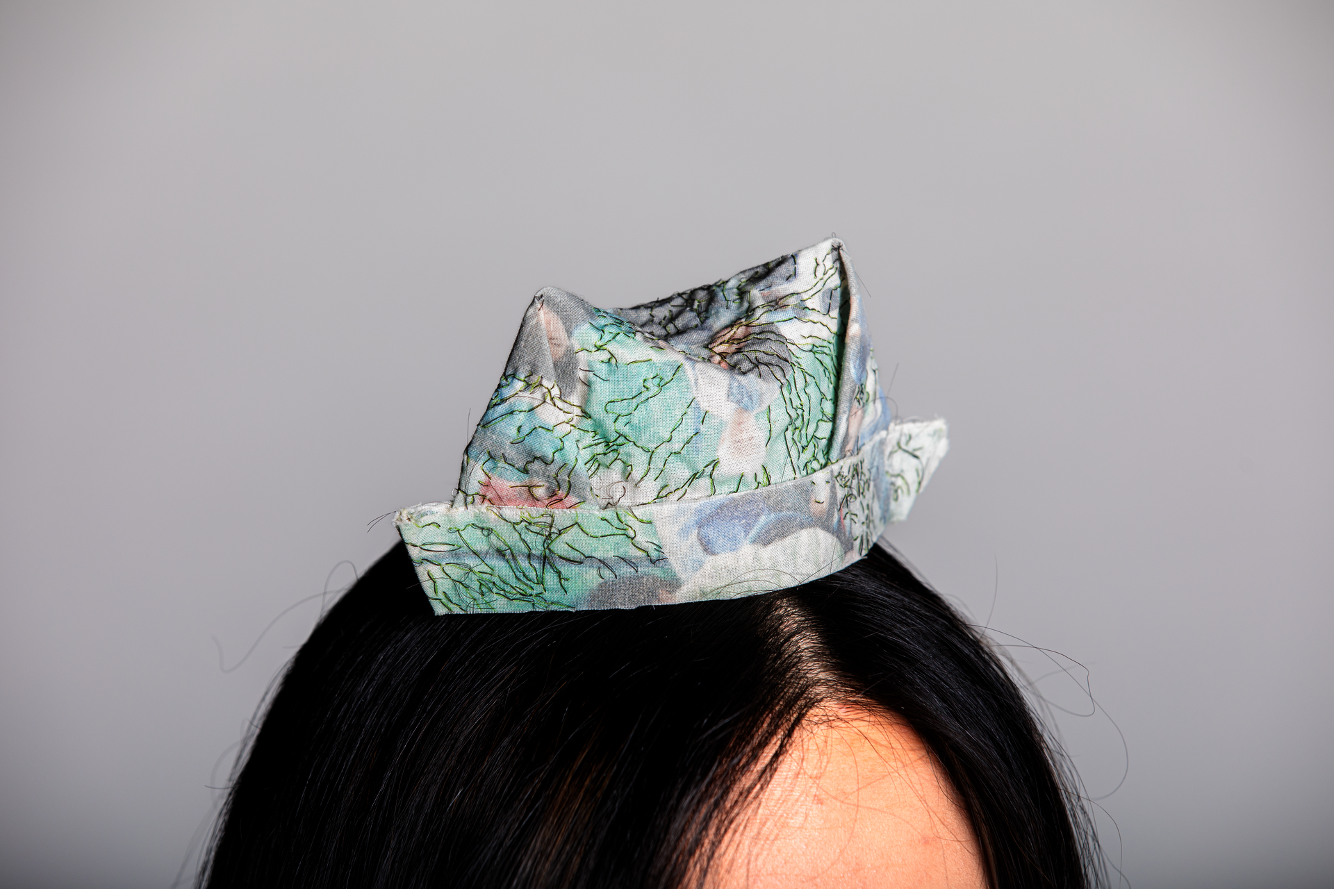 A hat mimicing the one artist used to wear as a baby. An homage to her female family members. (by Cloris Ding, 2023.)