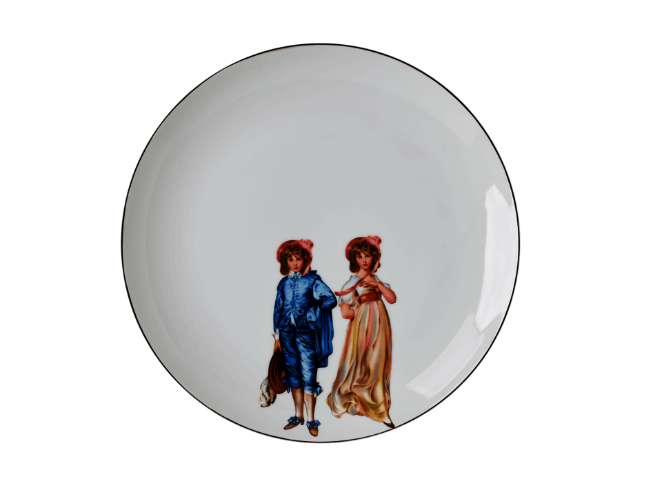 A white ceramic plate with an illustration of Victorian-style twins 
