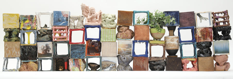 Collection of a variety of ceramic cube forms composed into wall shape. 