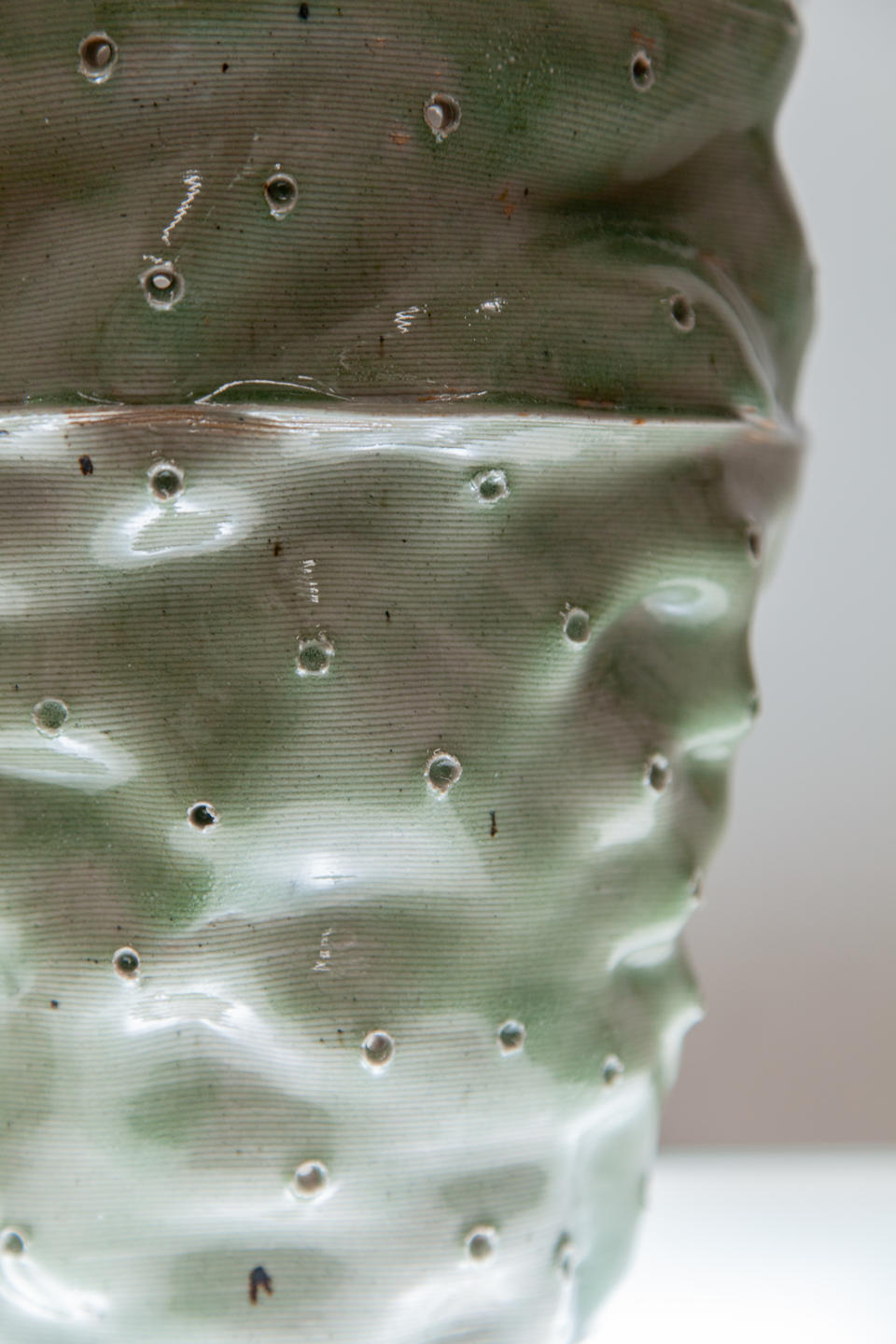 close up of ceramic tower glazed with beach sand