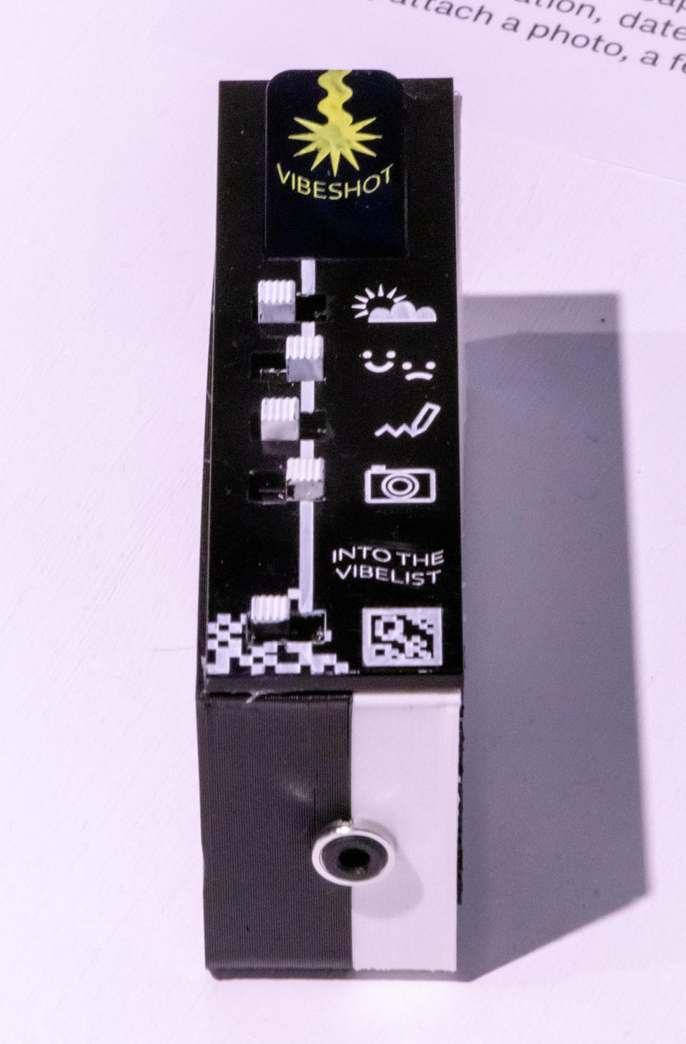 Photograph showing the vibelist and the audio jack (output) on the bottom of the device.